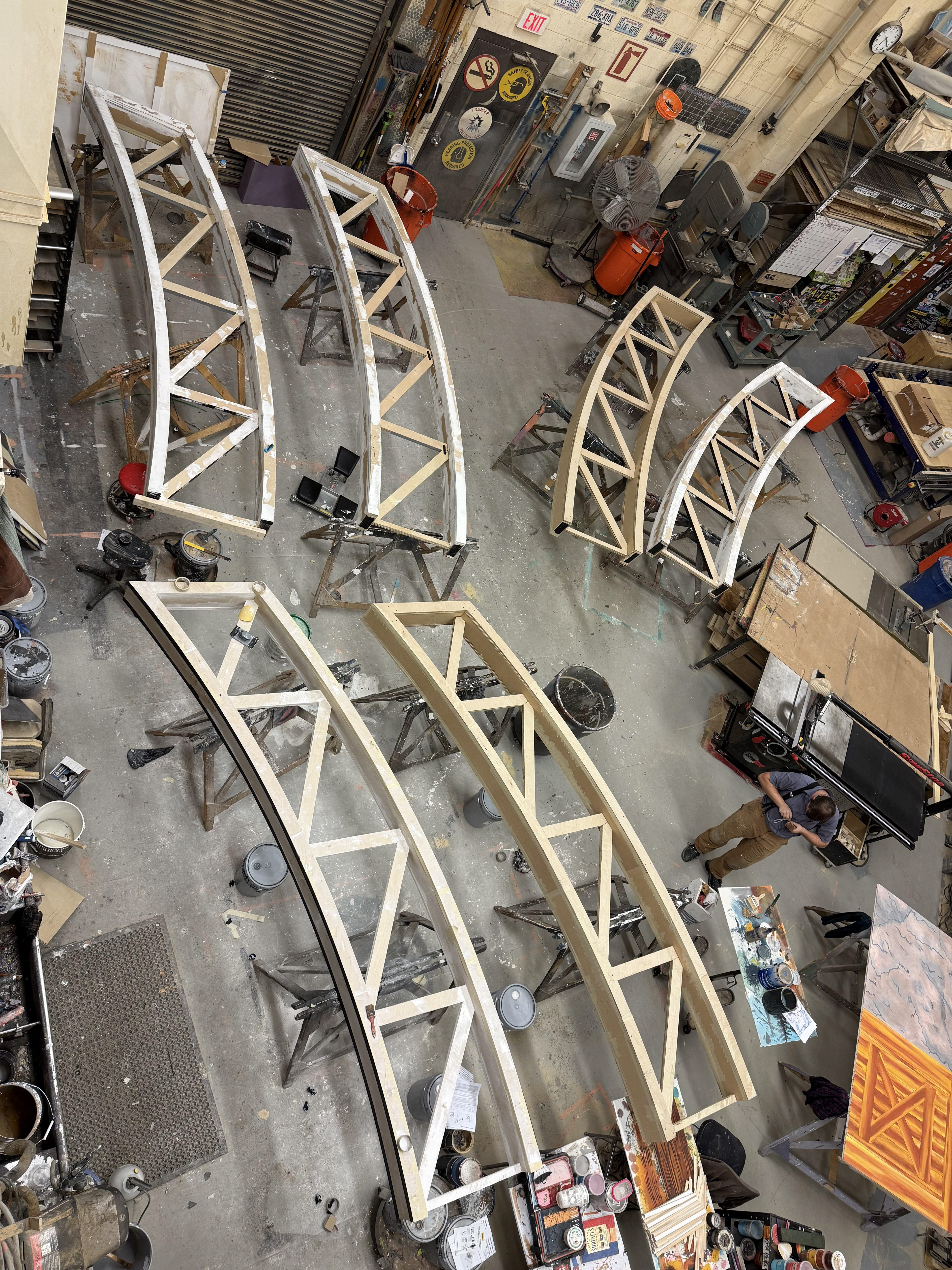 Truss pieces assembled in halves, waiting for paint