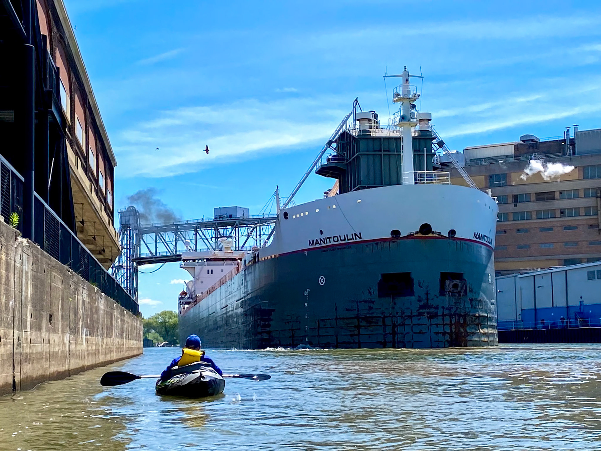 Kayaker and the Manitouin Lake Freighter, Buffalo NY