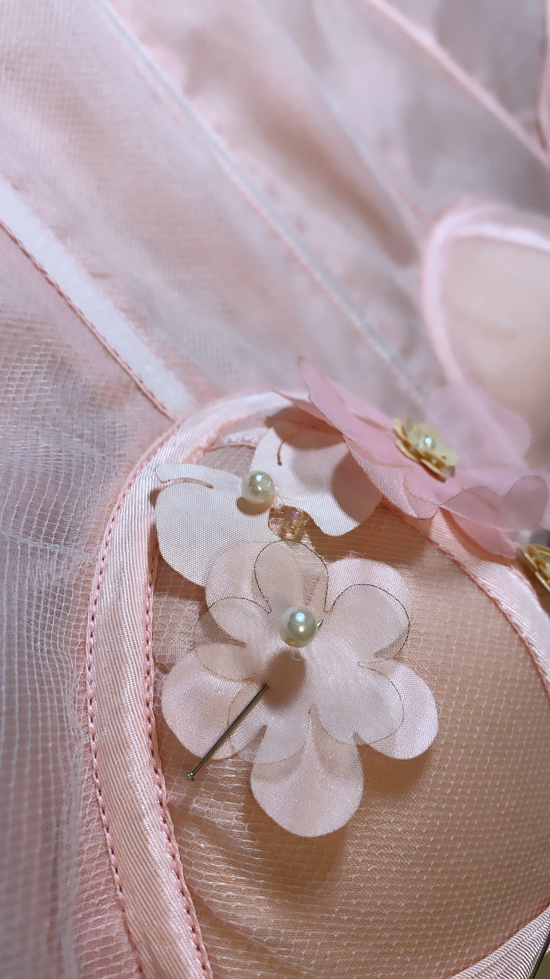 The laser cut organza flowers and cherubs were strategically placed on both the mesh top and the corset for dimension and texture.