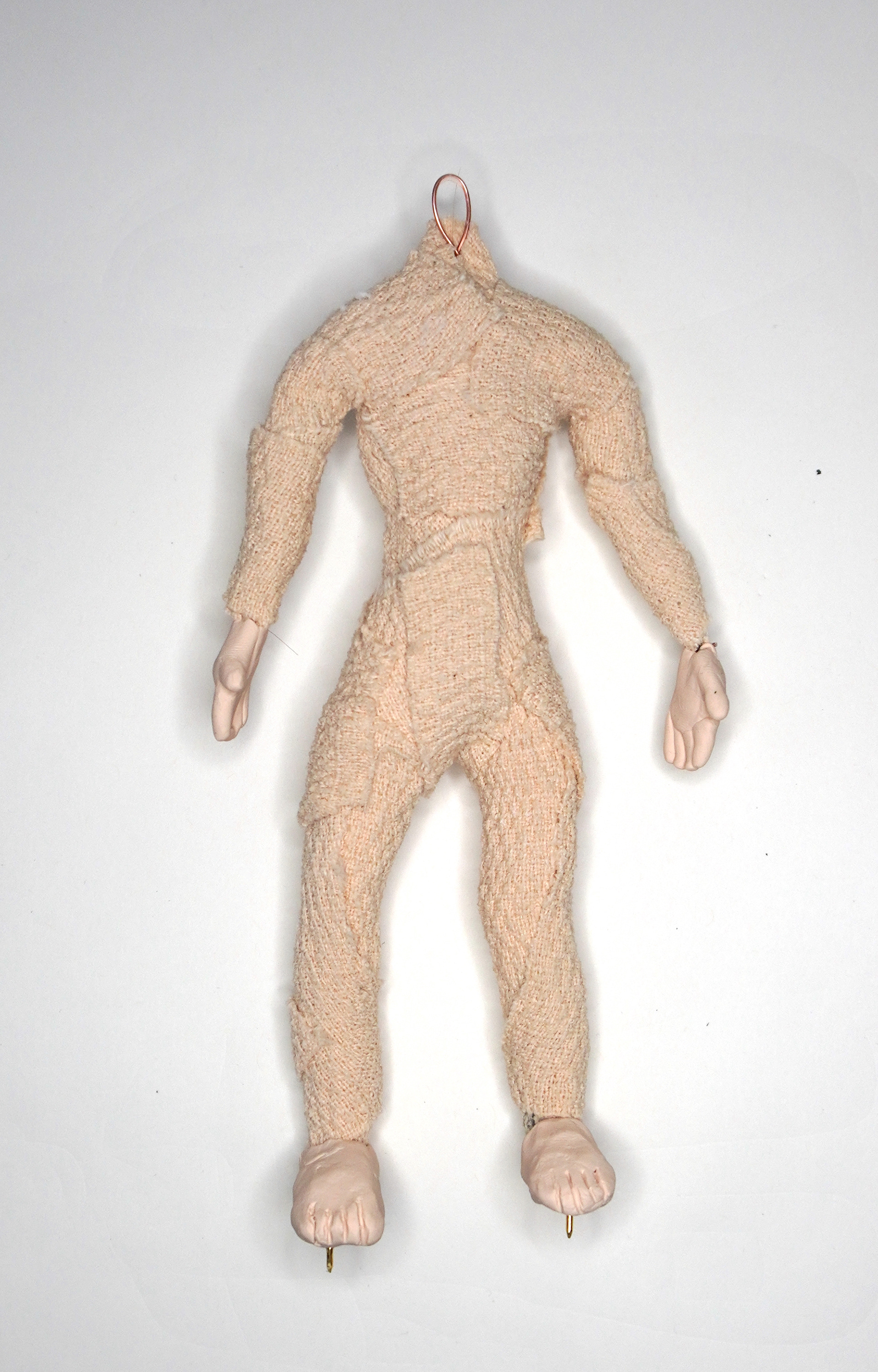 Body filled out with foam and self-adhesive bandages