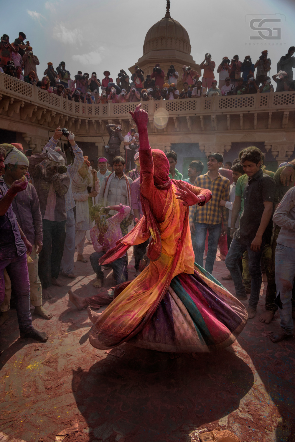 Boys dressed as females dance as they celebrate "Lathmar Holi" & Phoolo( ki holi at Barsana/Nandgaon in the northern Indian state of Uttar Pradesh. Holi also known as the Festival of Colours, heralds the beginning of spring and is celebrated all over India The story behind Lathmar Holi is that Lord Krishna visited Barsana to playfully tease his beloved Radha and her friends (gopis), by throwing colored water on them. Taking it as an offence, Radha and her friends chased Krishna to beat him up.