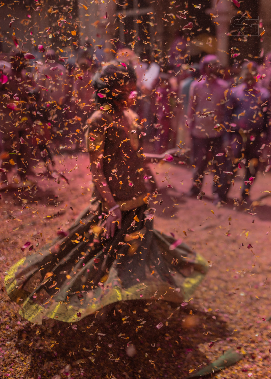 Girl dancing on the tunes of Radhe Radhe in one of the temple in Vrindavan during festival of colours and flowers, Holi., Blessings