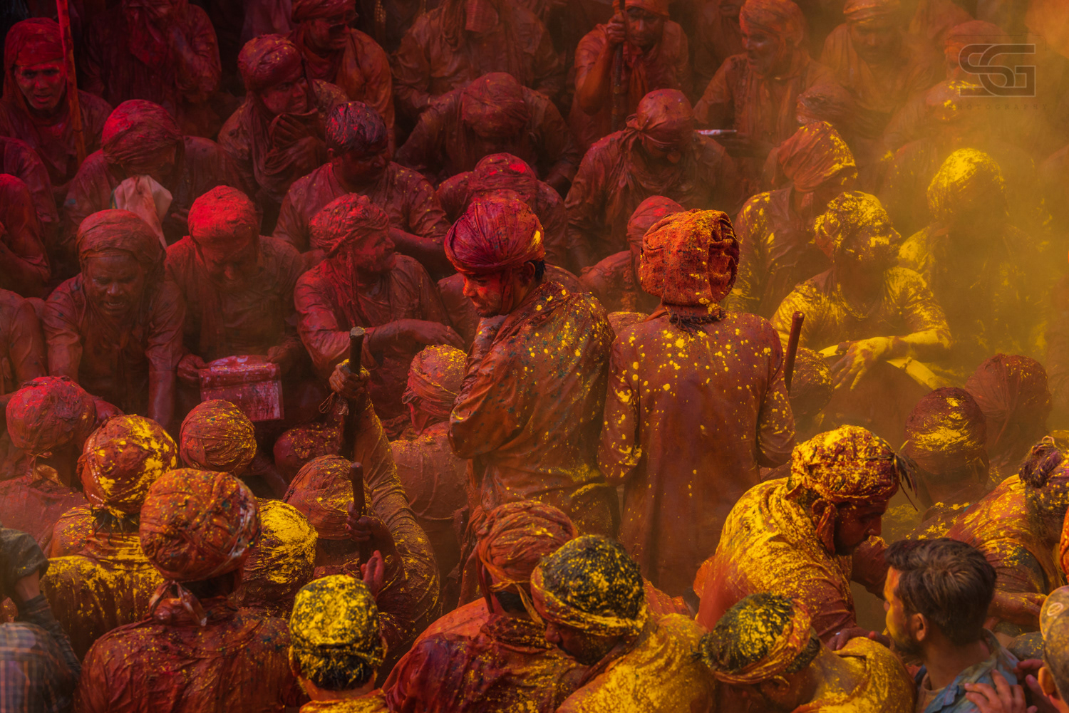 Samaj celebrating holi in Barsana / Nandgaon during Holi Festival in Vrindavan / Mathura, Uttar Pradesh, India