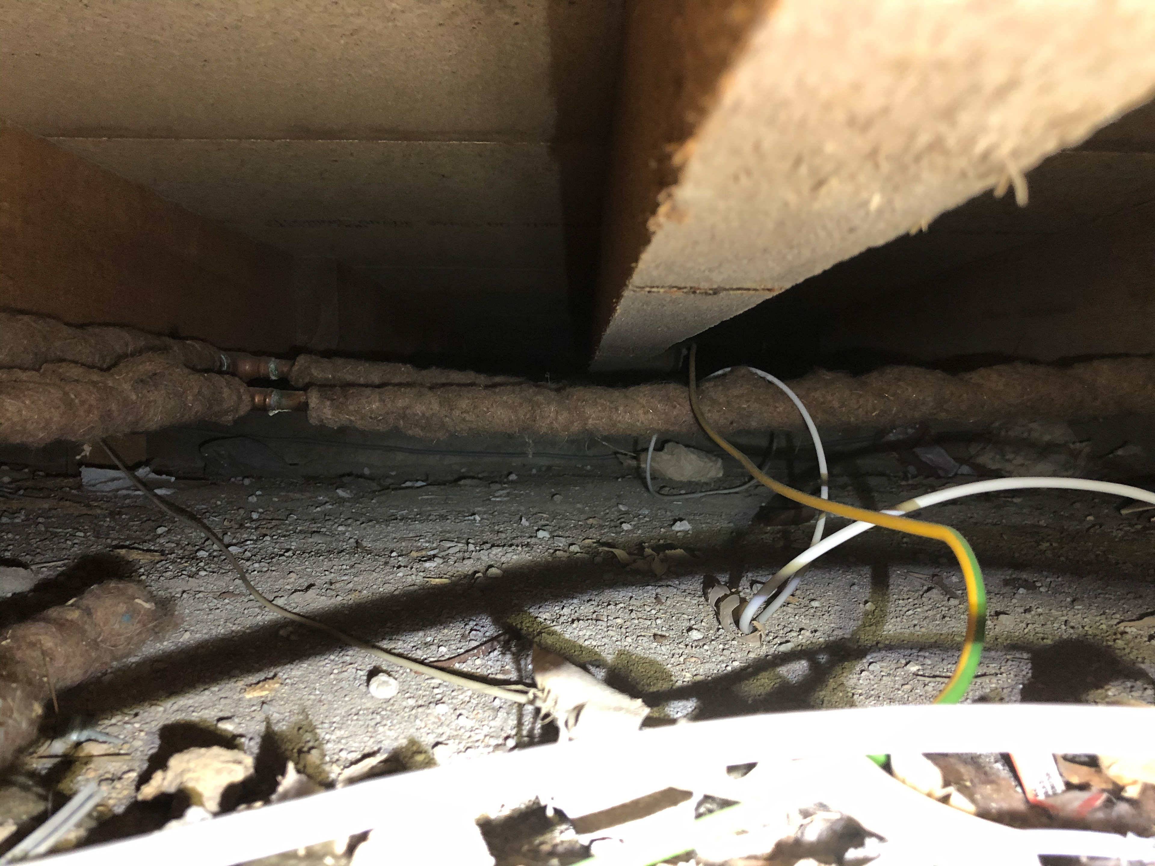 Poor services install and insulation at floor level