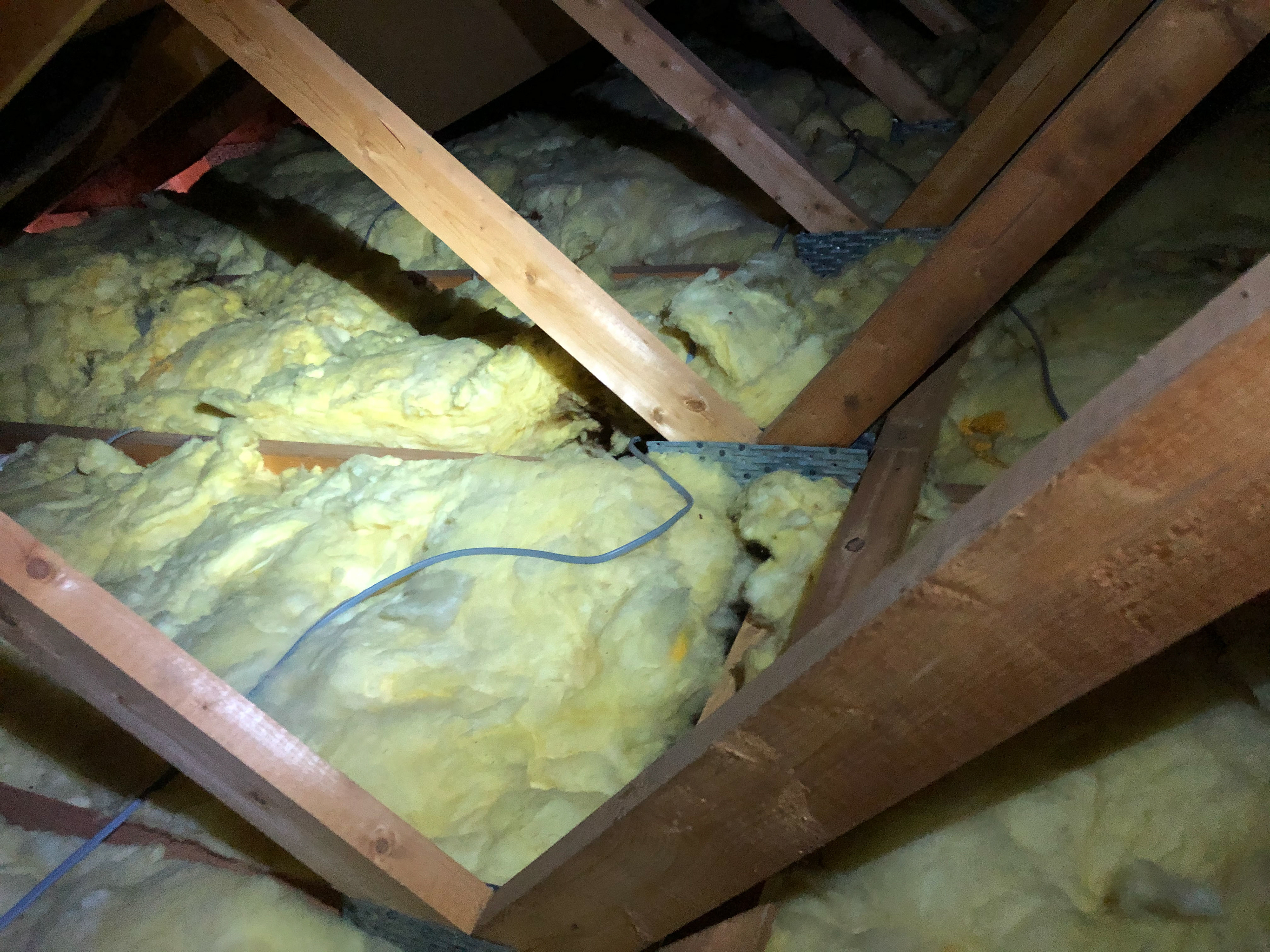 Low loft insulation levels and services disrupting