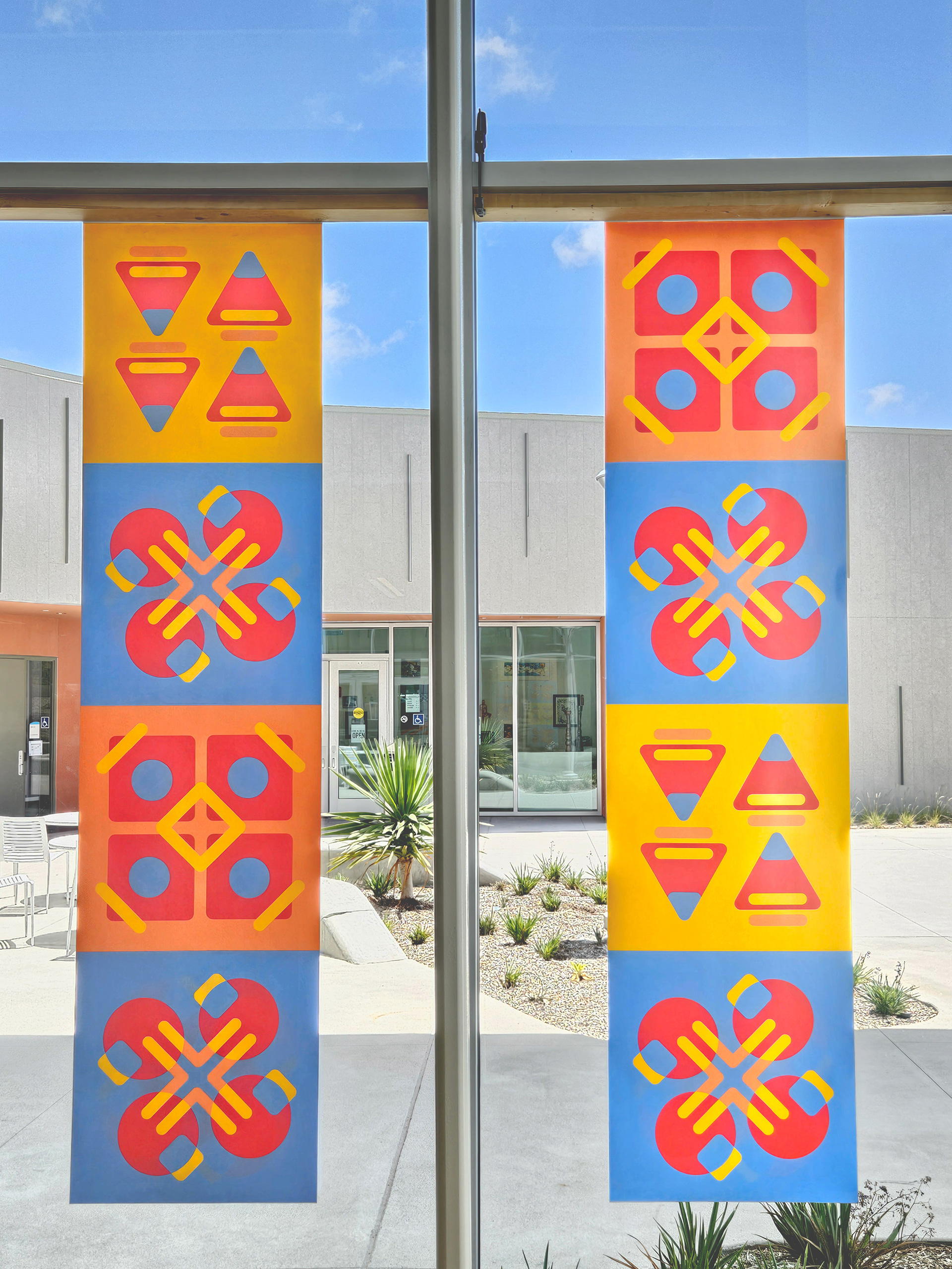 Wall banners hanging from inside the lobby.