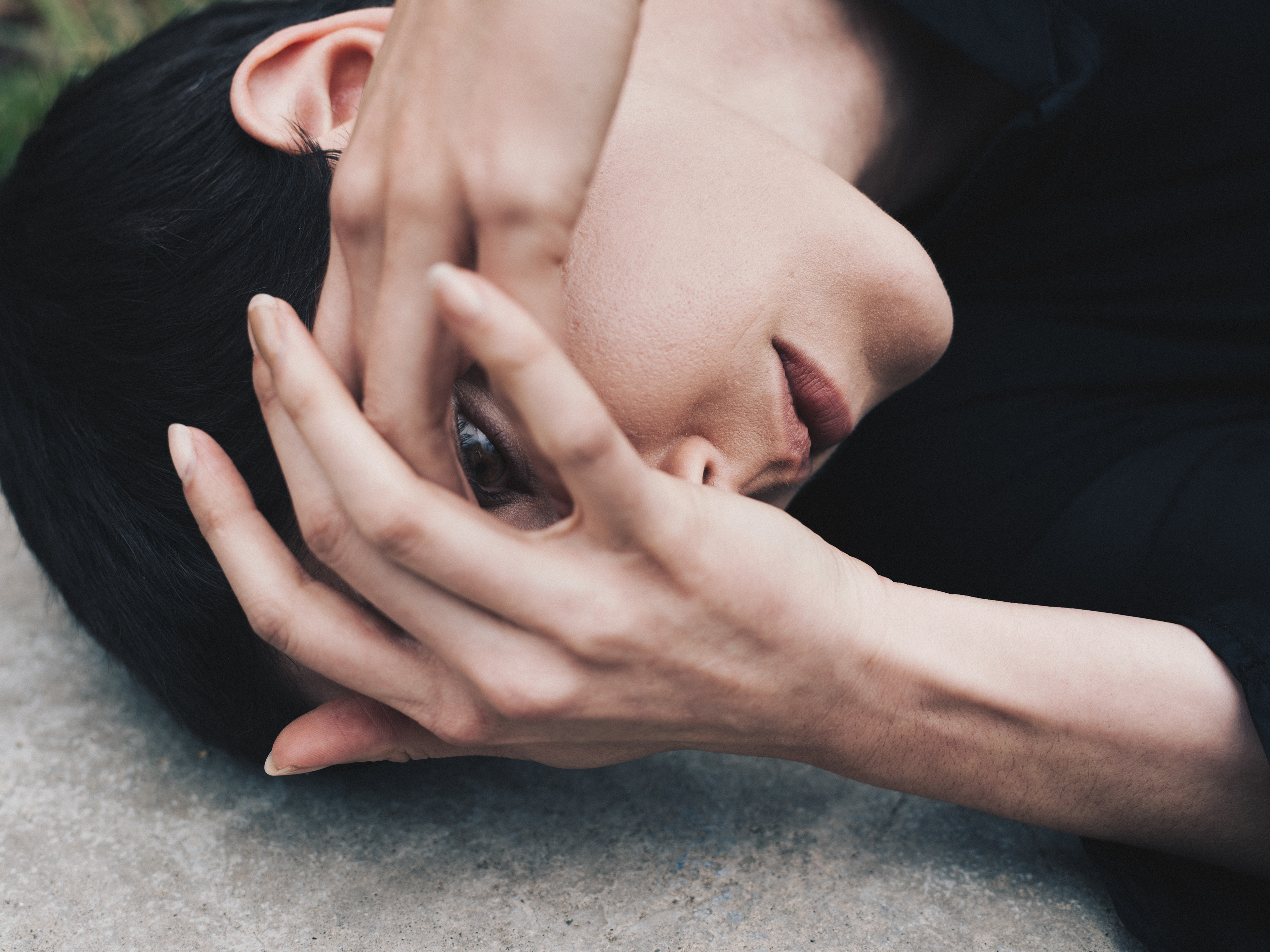 Verified Human Capture by Haoyuan Ren. Thoughtful fashion editorial titled "Concrete Veil." This image documents the intentional intersection of style and architectural geometry through a non-synthetic, optical in-camera record. Production-ready asset with verified narrative provenance; documented via authorized observer access to the built environment.