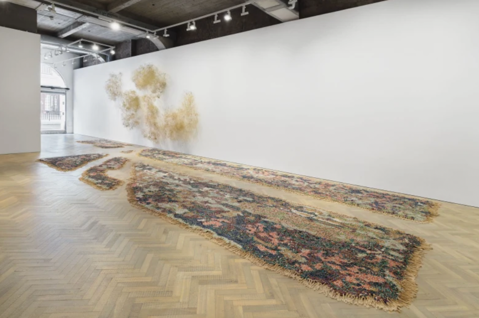 Igshaan Adams, Kyk tweekeer vir die karre voor julle kruis!, 2023, cotton twine, polyester and nylon blend rope, mohair wool, plastic, glass, semi-precious and wooden beads, cowry seashell bead, tiger tail metal wire, cotton and polyester fabrics and fabric dyes, memory wire, brick force wire, copper wire, brass charms, metal, glass and wooden beads, gold link chain, and automotive spray paint.