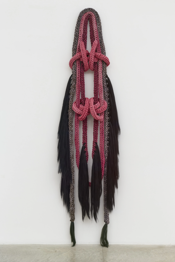 Tanya Aguiñiga, Seven Sisters (Celaeno), 2025, Cochinilla-dyed cotton rope and heckled flax, 102 × 27 × 8.5 in (259.1 × 68.6 × 21.6 cm).