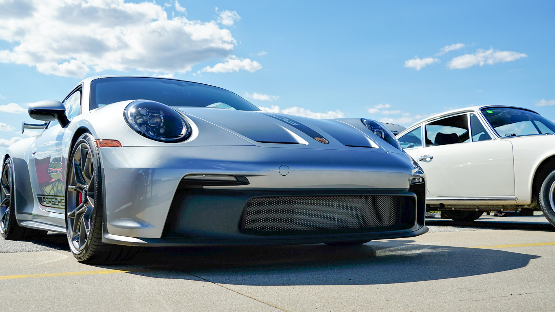 Porsche 911 GT3 Description: Three/fourths view of a Porsche 911 GT3 parked at an automotive event.