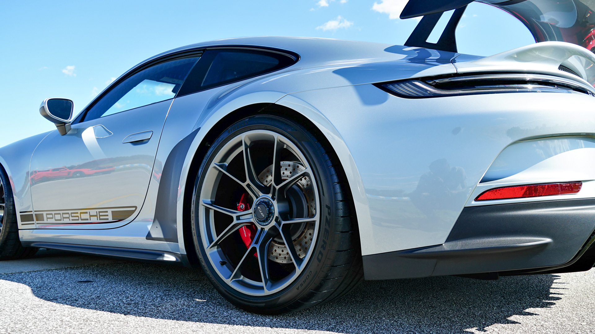 Porsche 911 GT3 Description: Three/fourths view of a Porsche 911 GT3 parked at an automotive event.