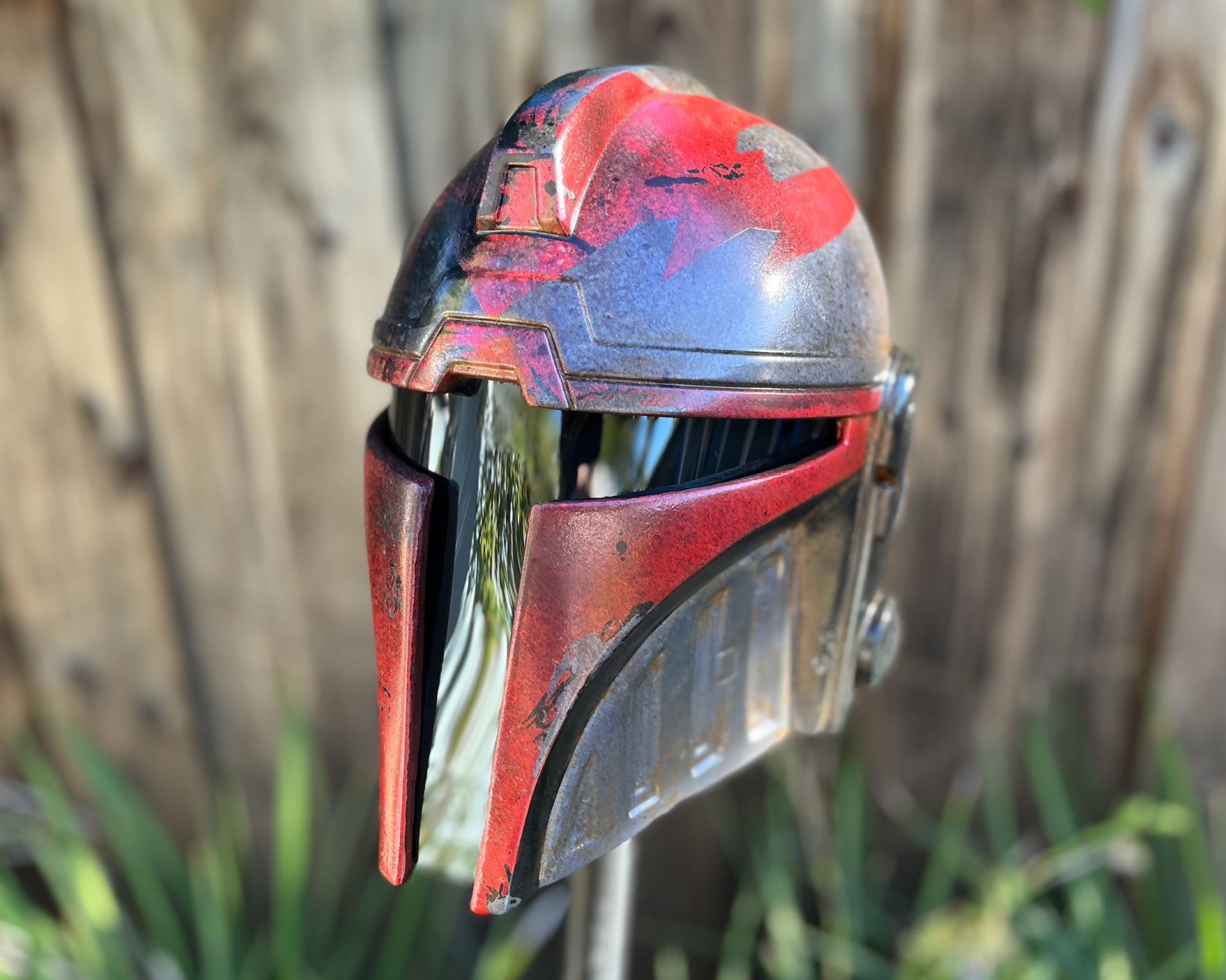 Resin cast black and red Aran Tal Mandalorian helmet. October 2024.