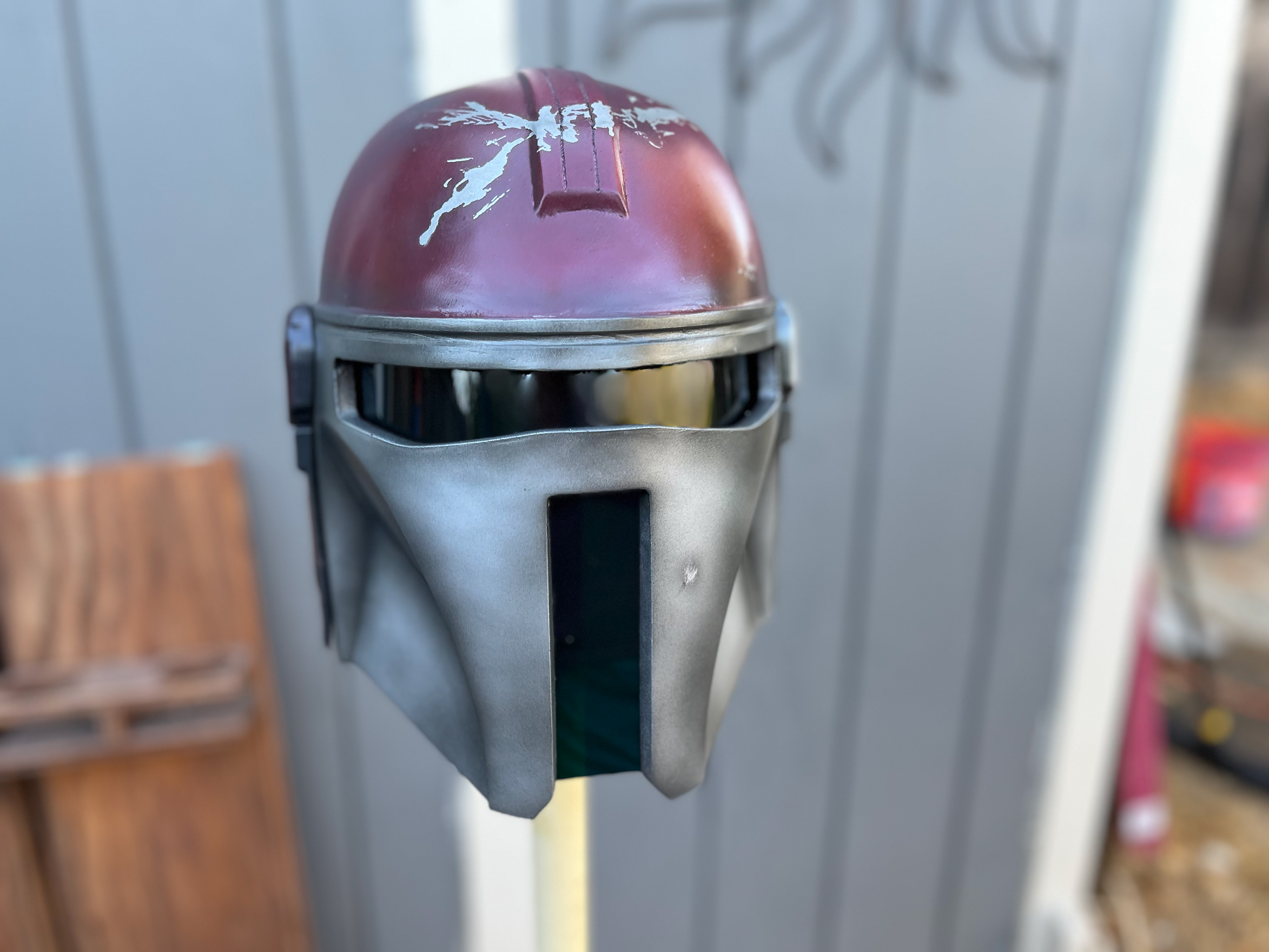 3D Printed Commandalorian helmet (maroon and chrome). Jul 2023.