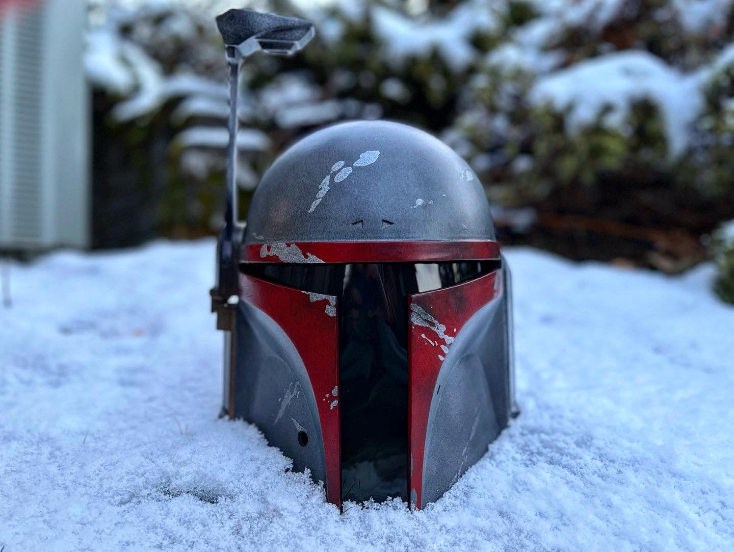 3D Printed Mandalorian helmet (red and grey). Digital files from Buck's Armory. Feb 2022.