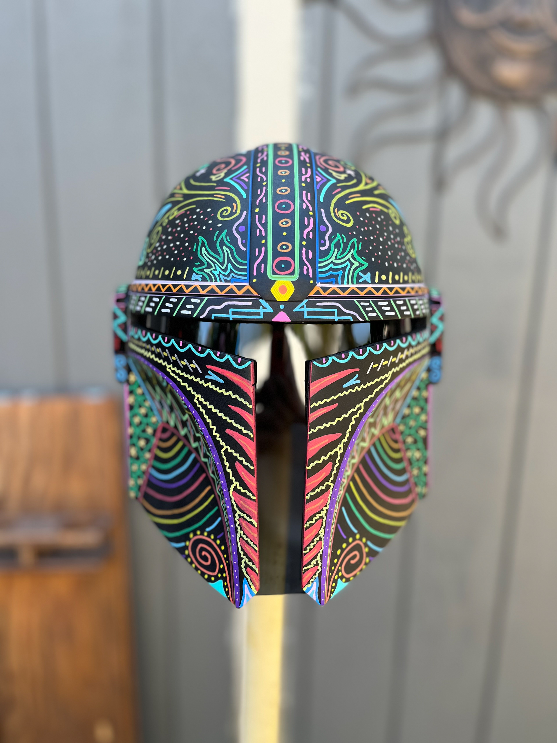 Resin cast Mandalorian helmet finished with Posca paint pens. Resin cast from Rowland FX. Jul 2023.