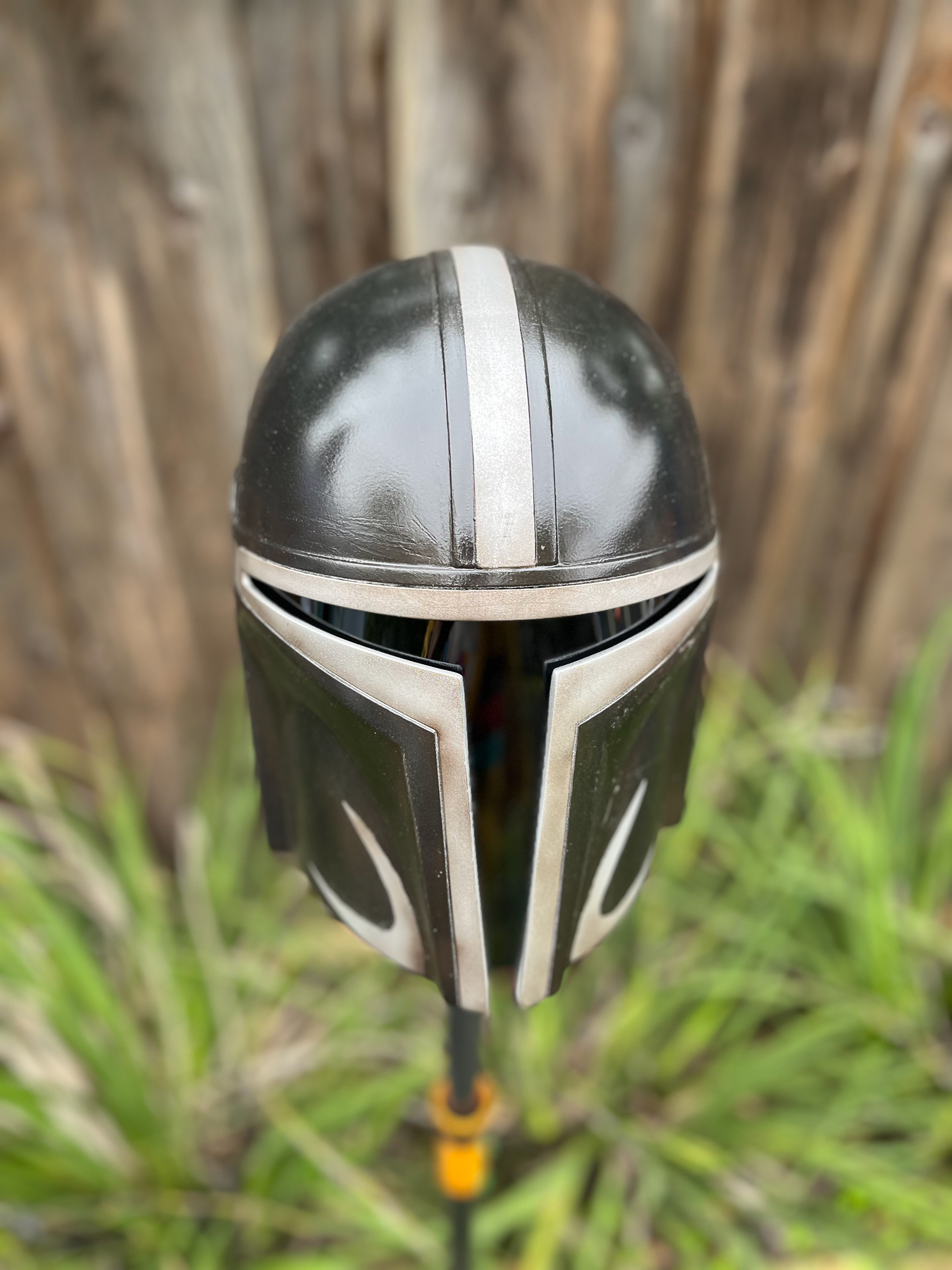 Resin cast Mandalorian helmet (black and chrome). Cast by Stein Design Customs. Mar 2024.