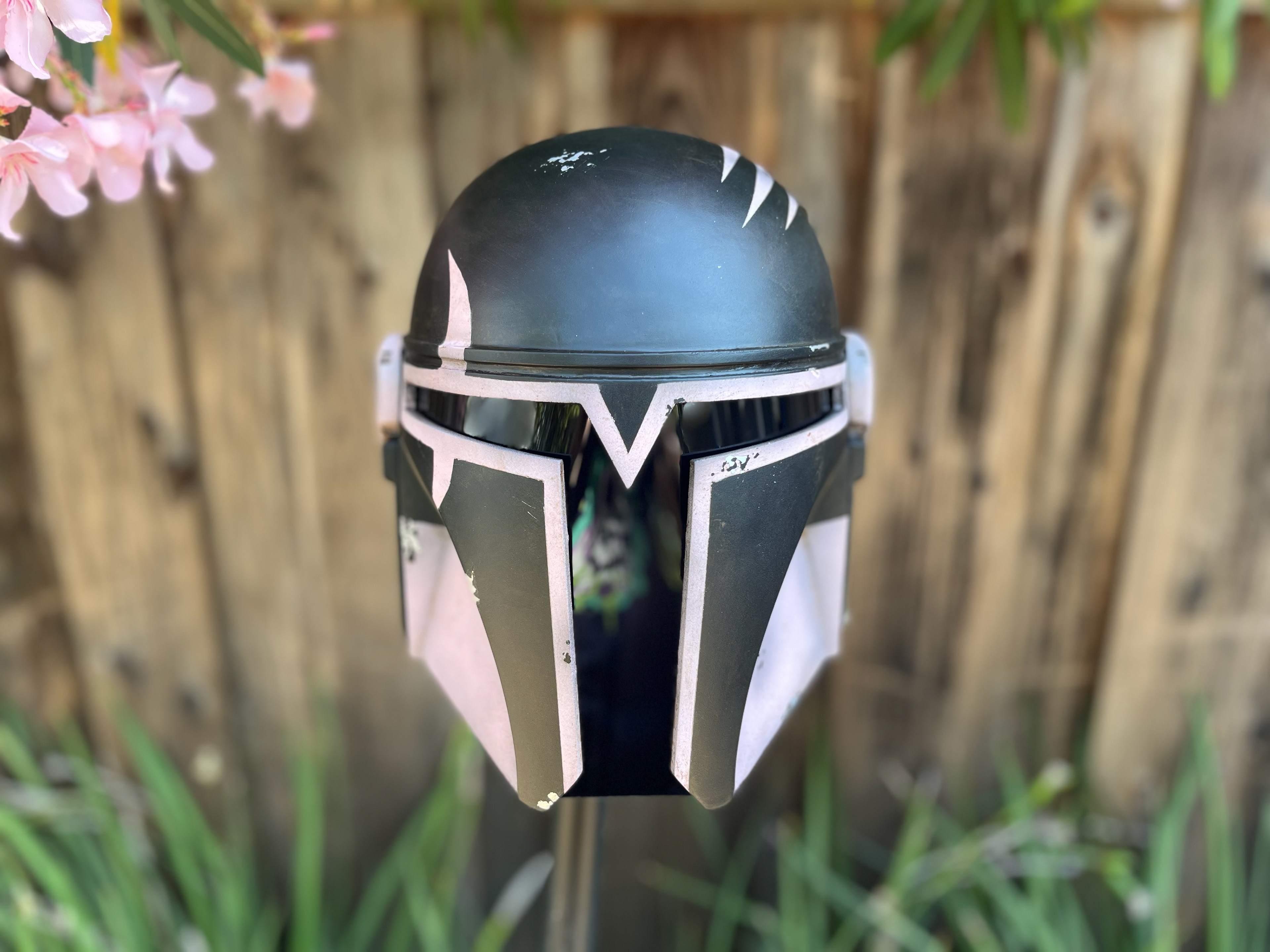 3D printed custom pink and black Mandalorian helmet. Jul 2024.