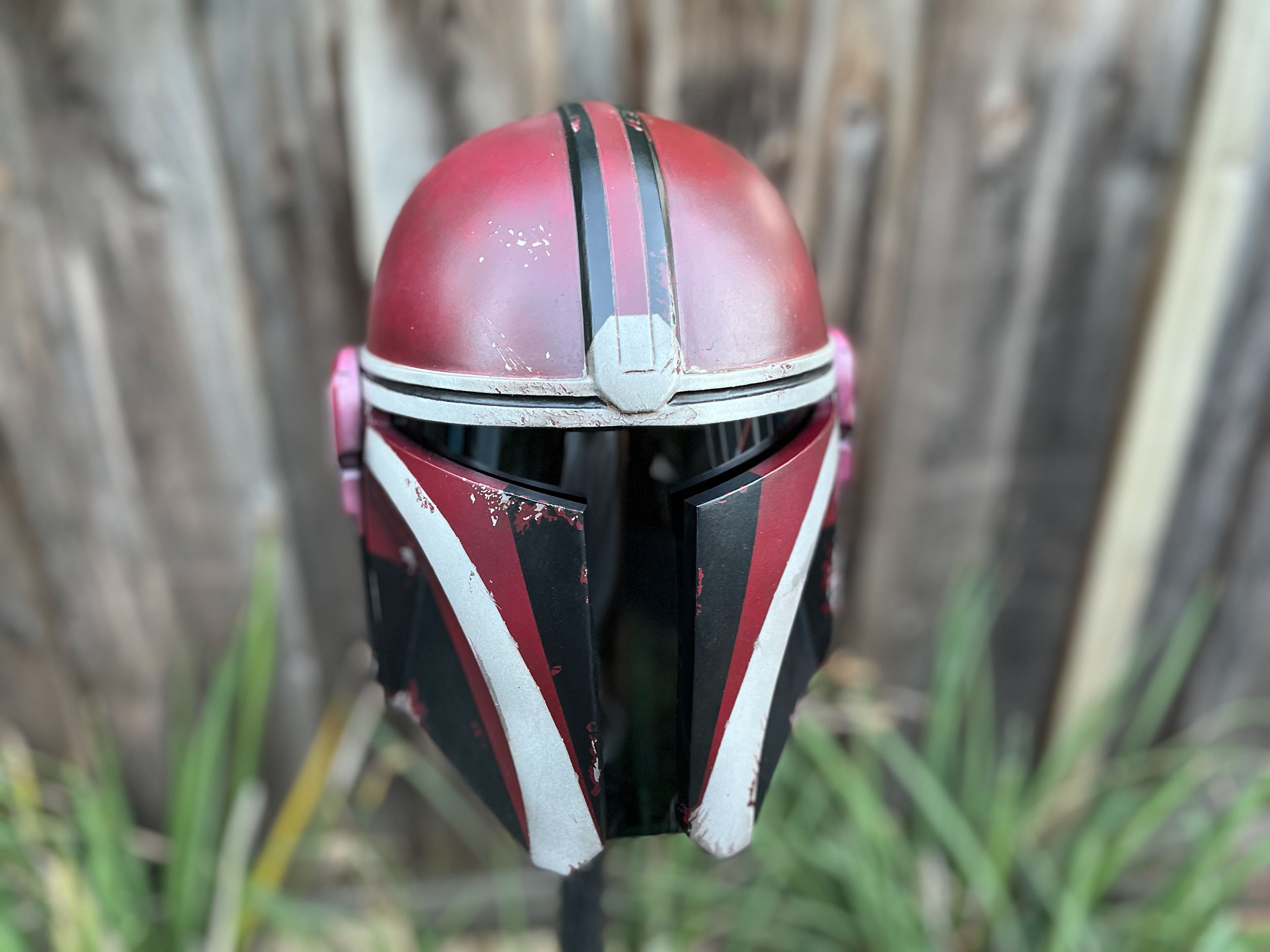 3D Printed Mandalorian helmet (red, white, and black). Oct 2023.