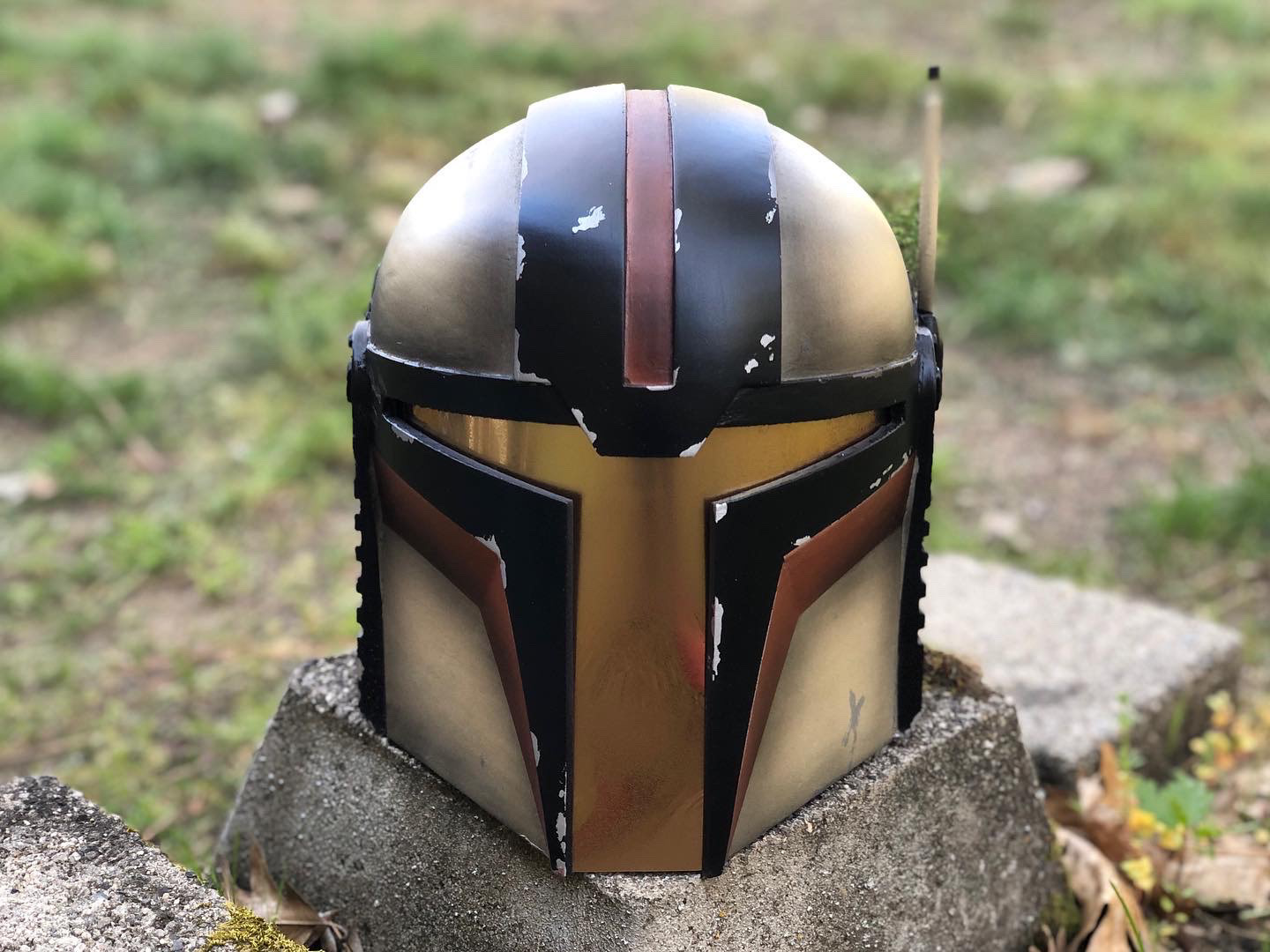 3D Printed Mandalorian helmet (tan, brown, and black). Digital files by Buck's Armory. Jun 2021.