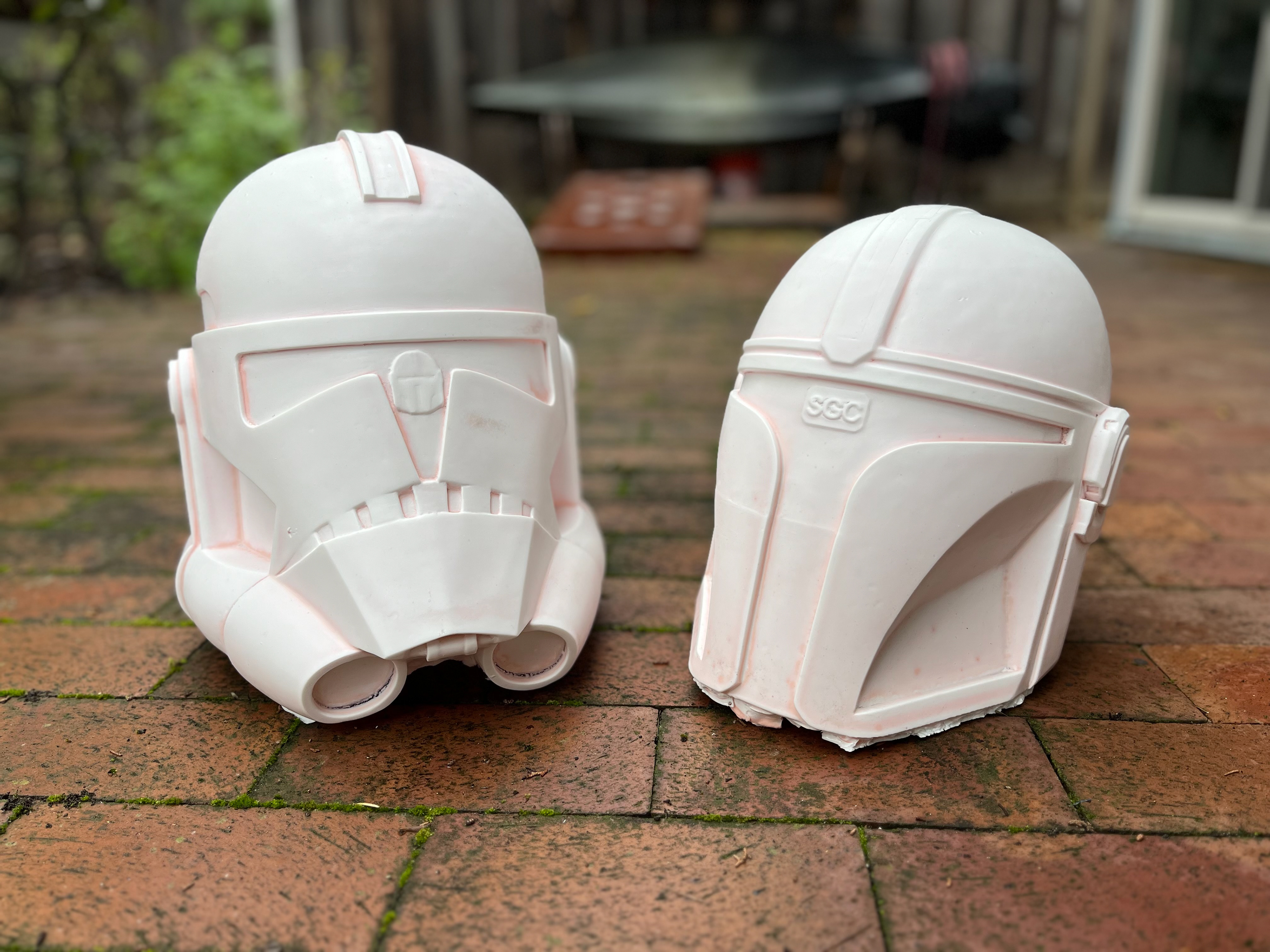 Resin cast Clone Trooper (left) and Mandalorian (right) helmets. Feb 2024.