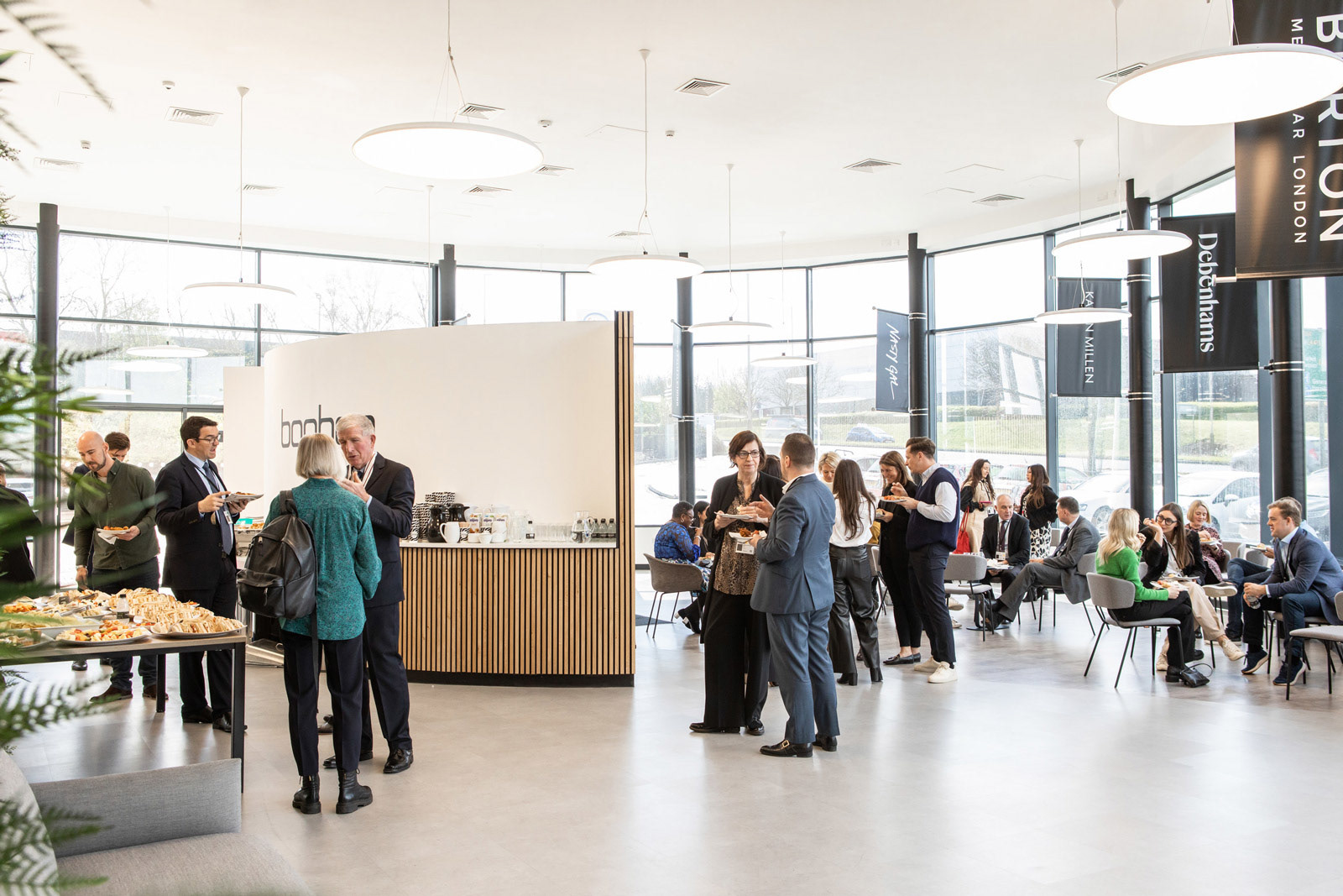 Thurmaston Lane foyer hosting an event, with branded wall flags