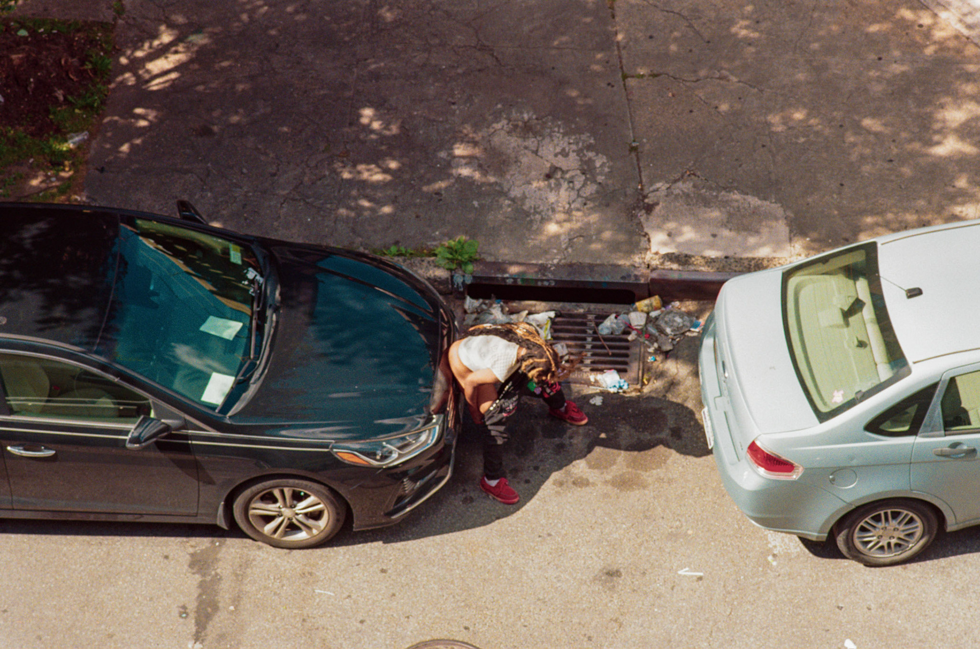 woman peeing on a car