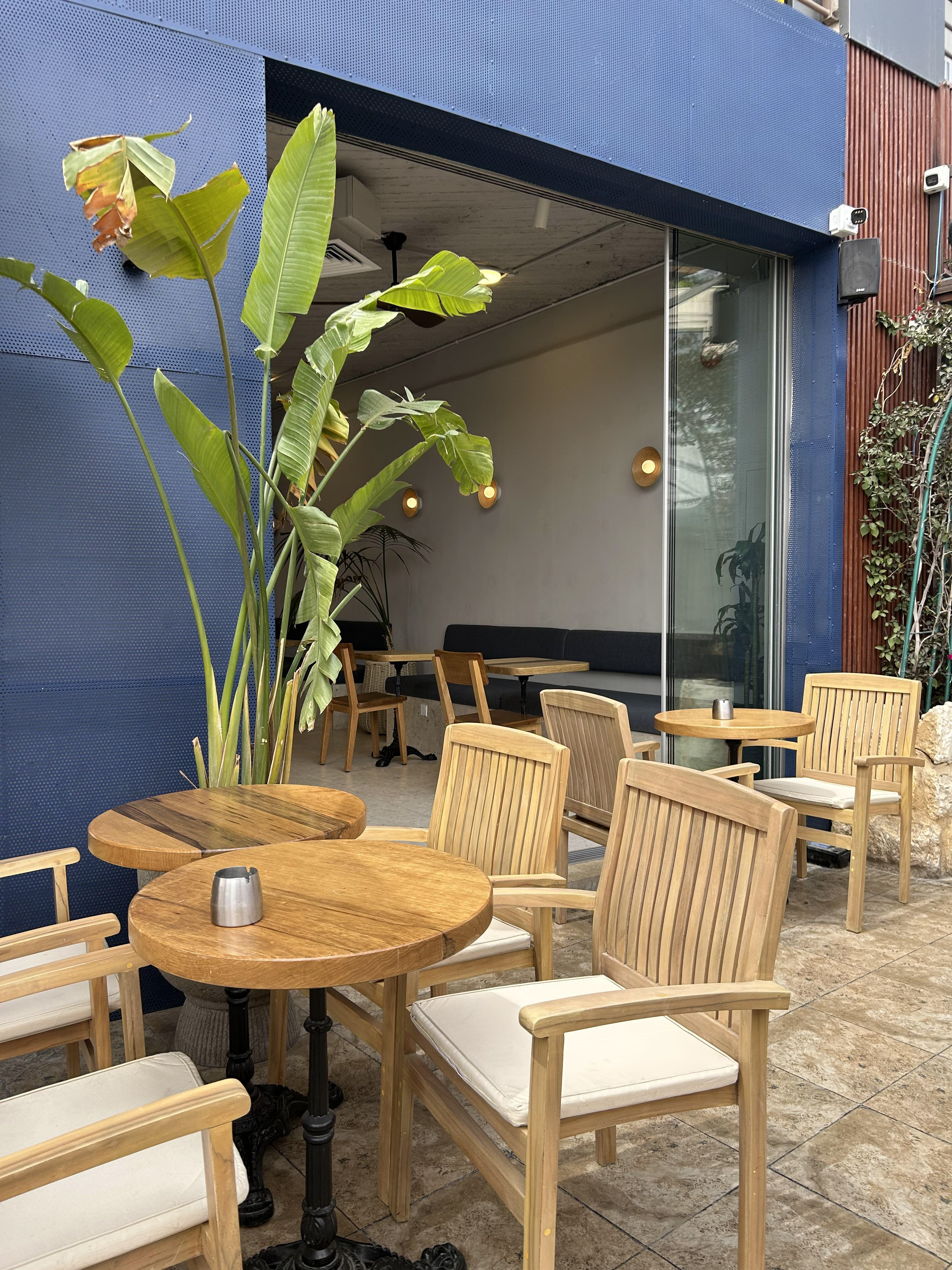 Azul bakery and coffee house interior design in Amman Jordan. Exposed ceiling, modern, minimalist, plants, wood.