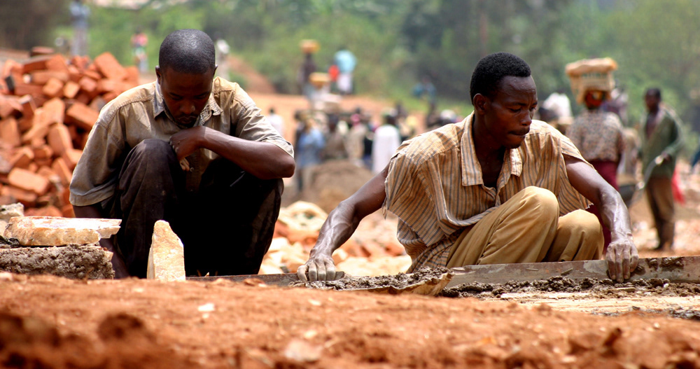 Workers construct the car park at the Kigali Genocide Memorial - March 2004.