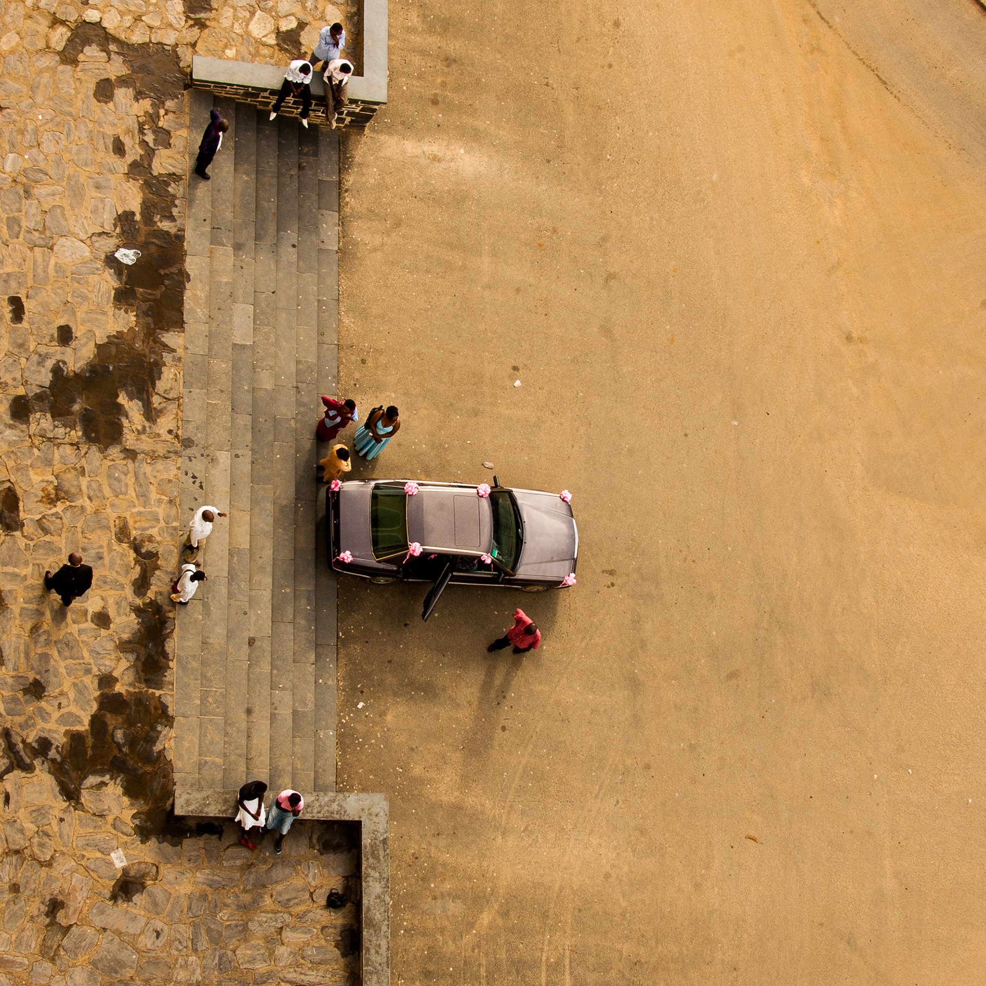 Taking a good wedding photograph can even require climbing to the top of the church bell tower.