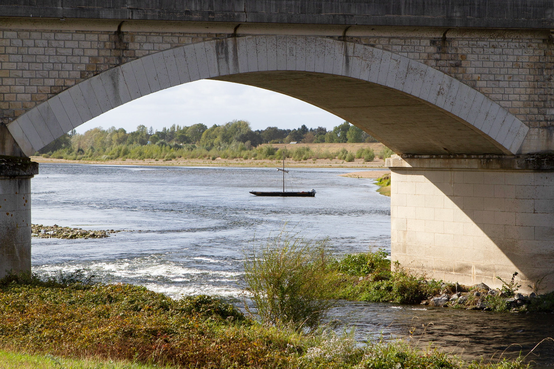 A look under the bridge to the river Loire on a sunny autumn day