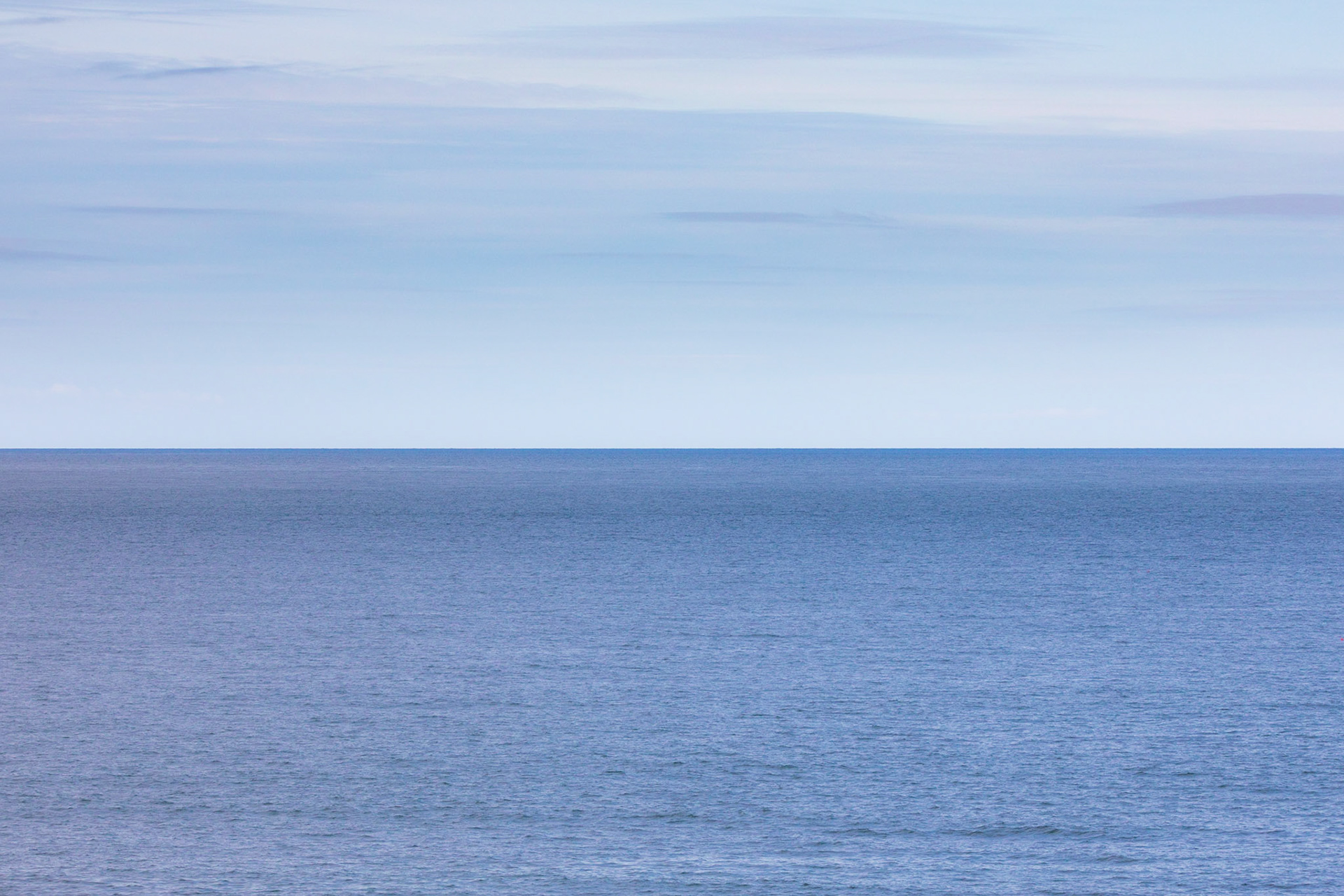 Serene blue horizon at Porth Dafarch, Holy Island, Anglesey, Wales, United Kingdom.