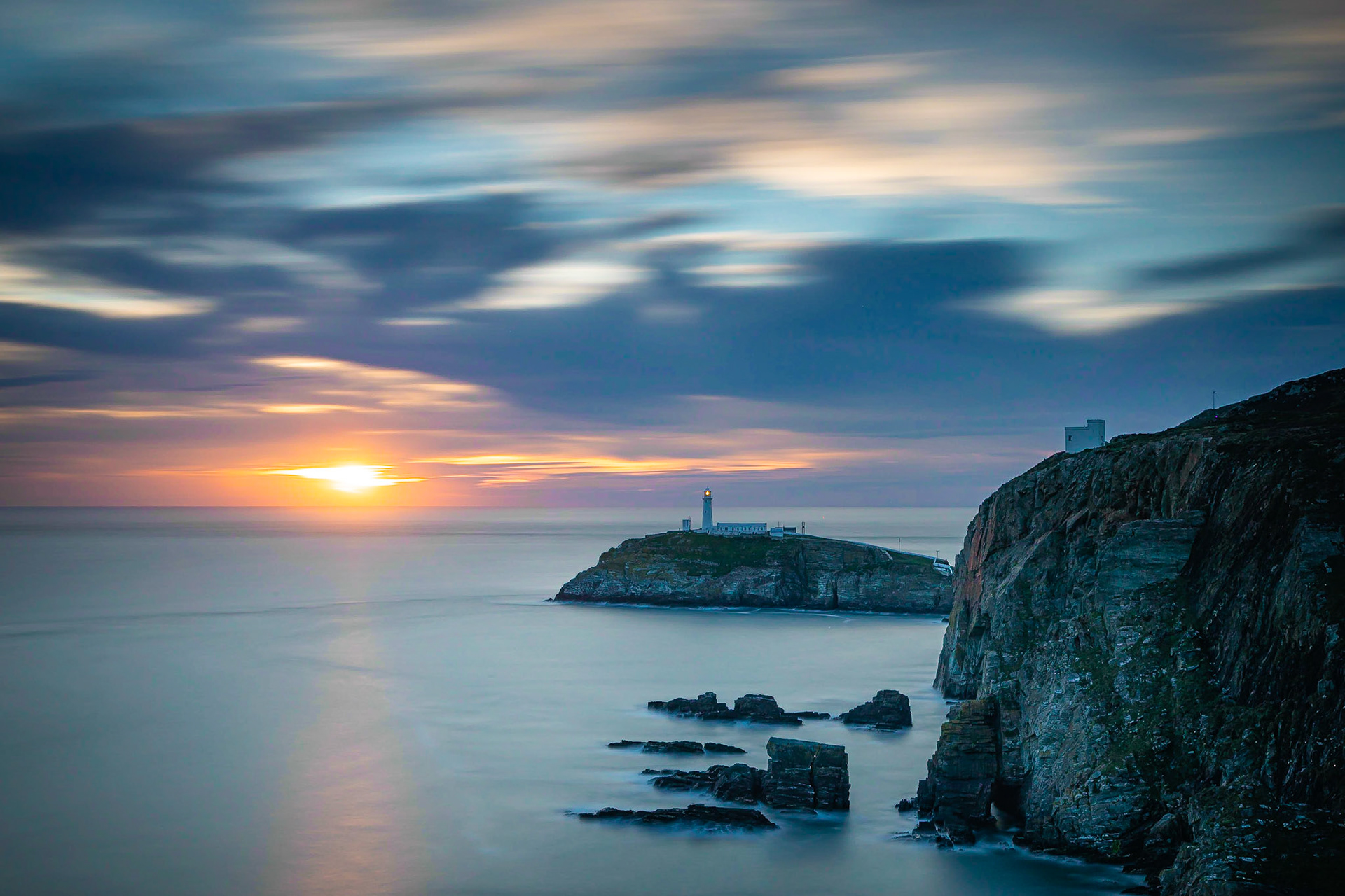 Sunset at South Stack Lighthouse, Holy Island, Anglesey, Wales, United Kingdom.