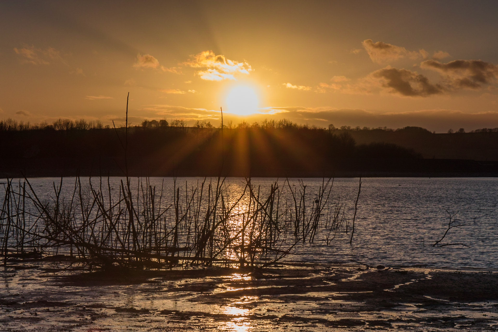 Sun setting over Carsington Water, Derbyshire.