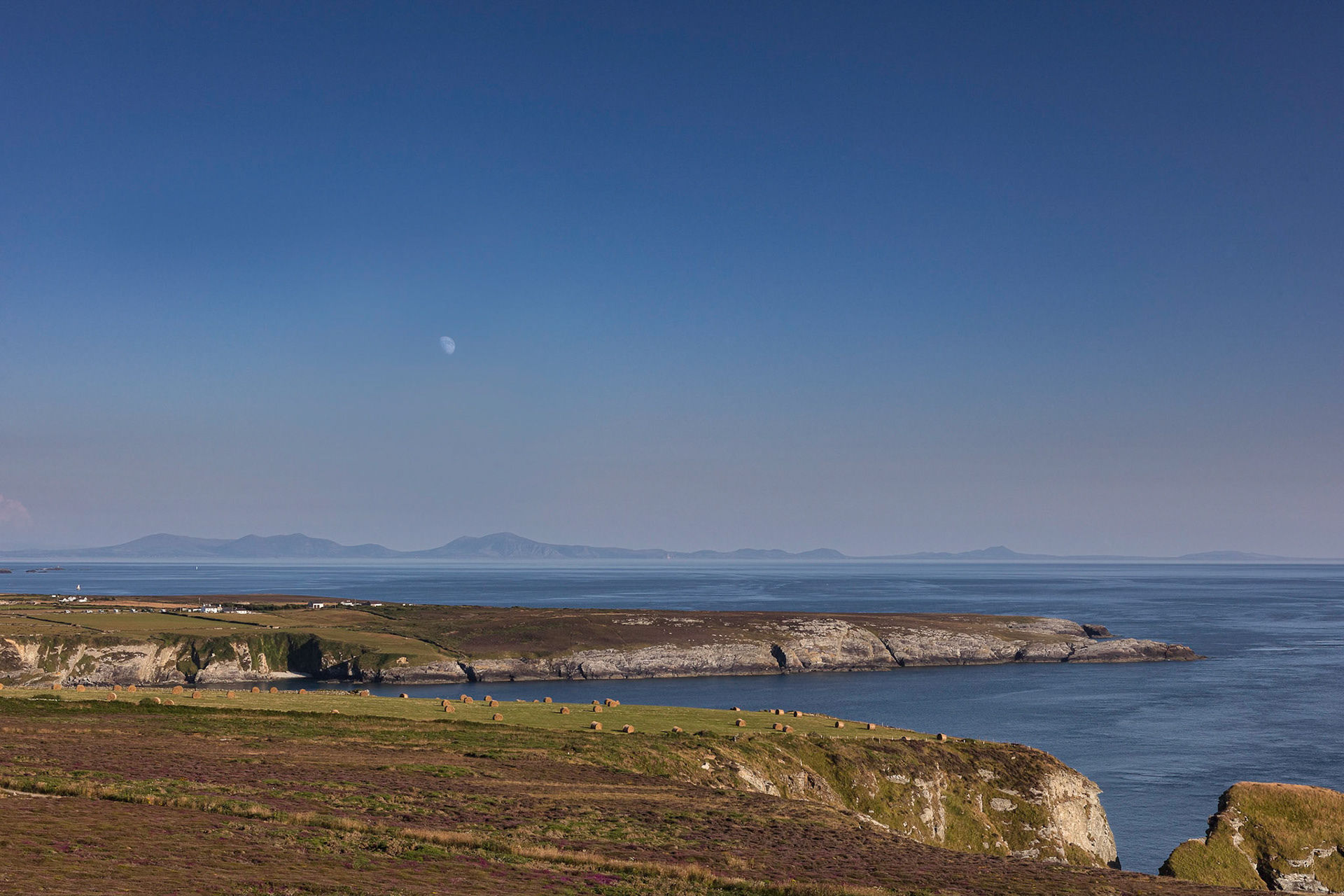 Moon rising over The Range, South Stack, Anglesey.