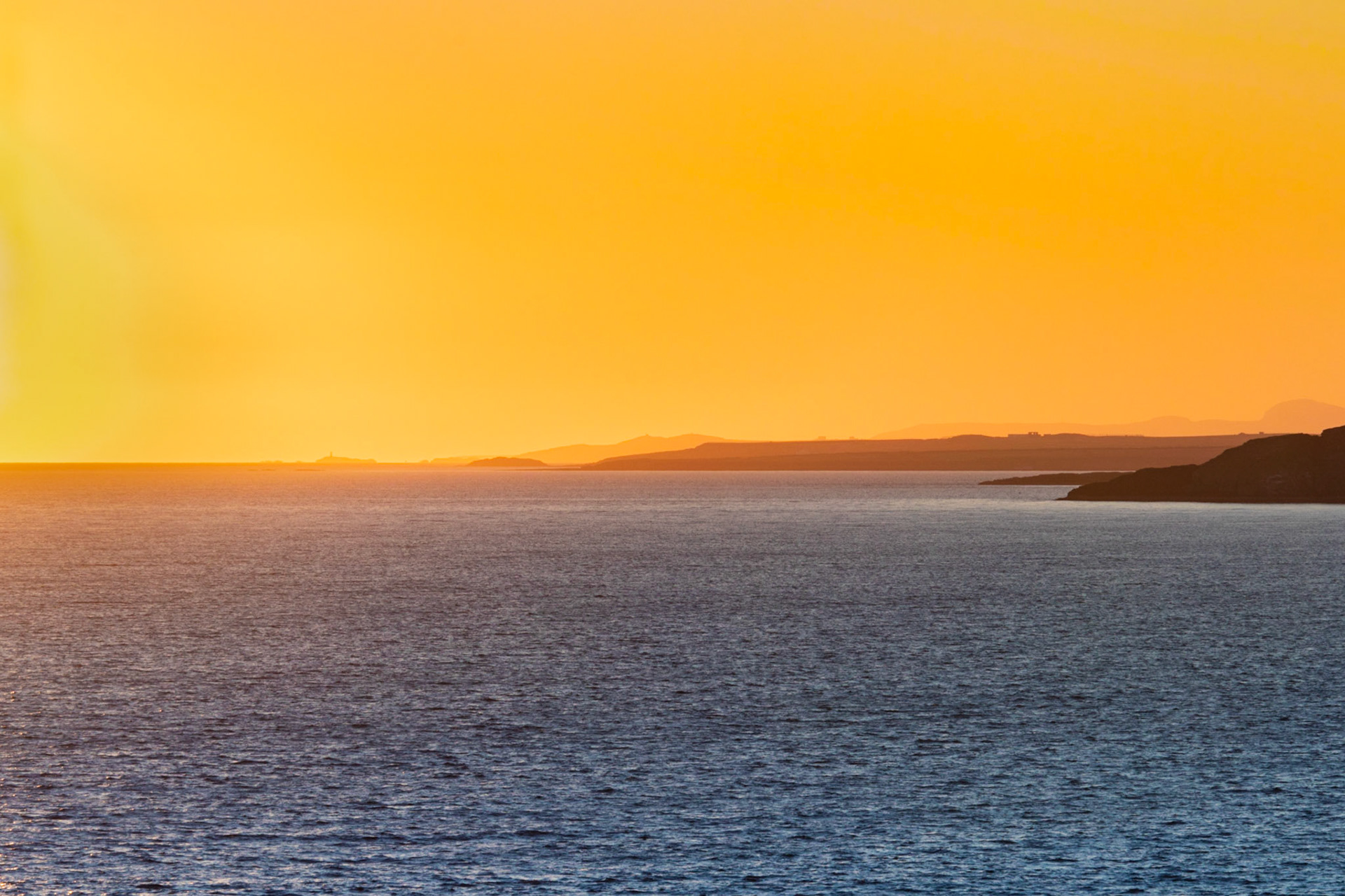 Sunset at Ynys Llanddwyn looking back towards Rhoscolyn Beacon.