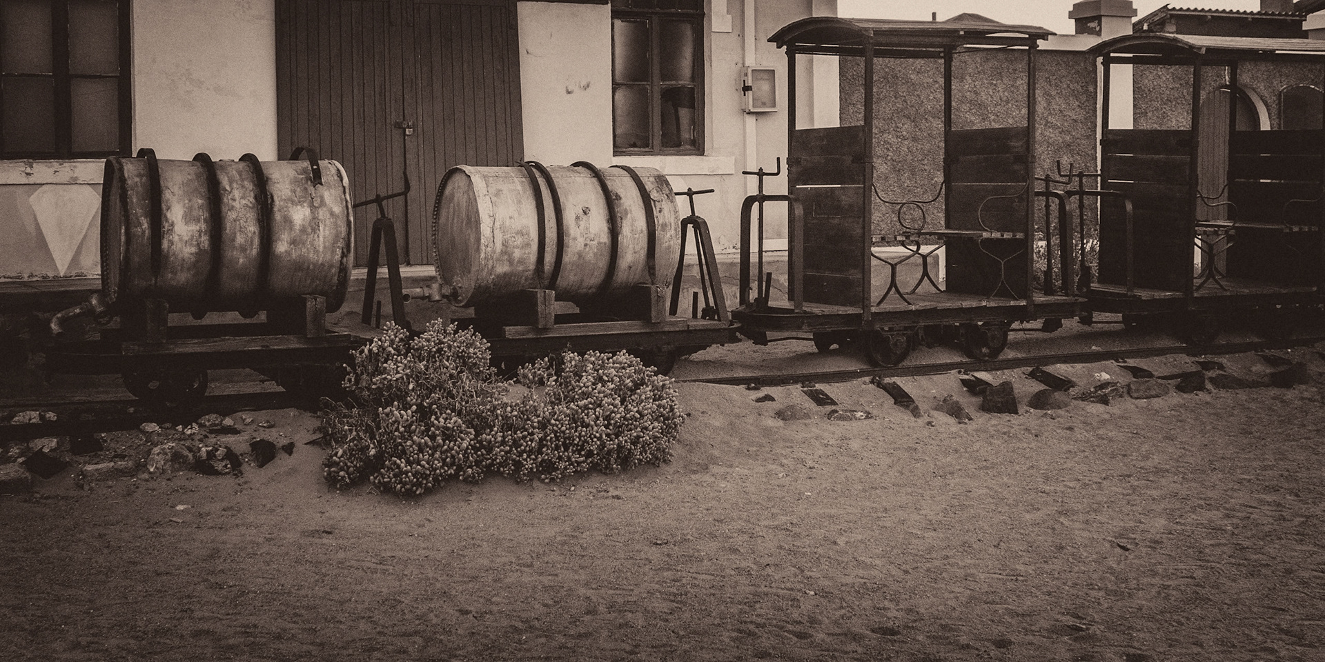 Kolmanskop was the first mining town built in the Namib after diamonds were discovered in 1908.  Water had to be trucked in from 60 miles away, there were high winds day and night with sand everywhere.  The town survived until 1943.