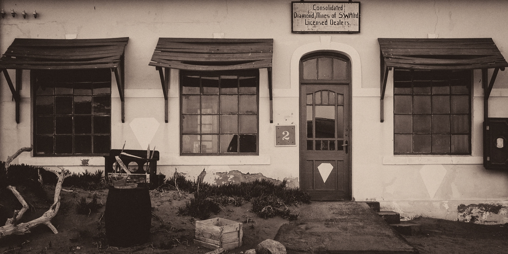 Kolmanskop was the first mining town built in the Namib after diamonds were discovered in 1908.  Water had to be trucked in from 60 miles away, there were high winds day and night with sand everywhere.  The town survived until 1943.