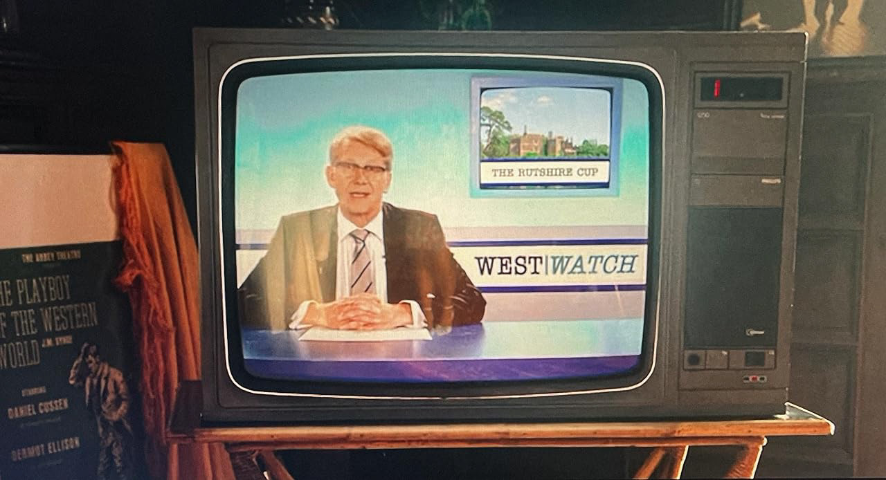 My character Andrew Alderman on a retro television screen presenting the fictional 'West Watch' news programme.