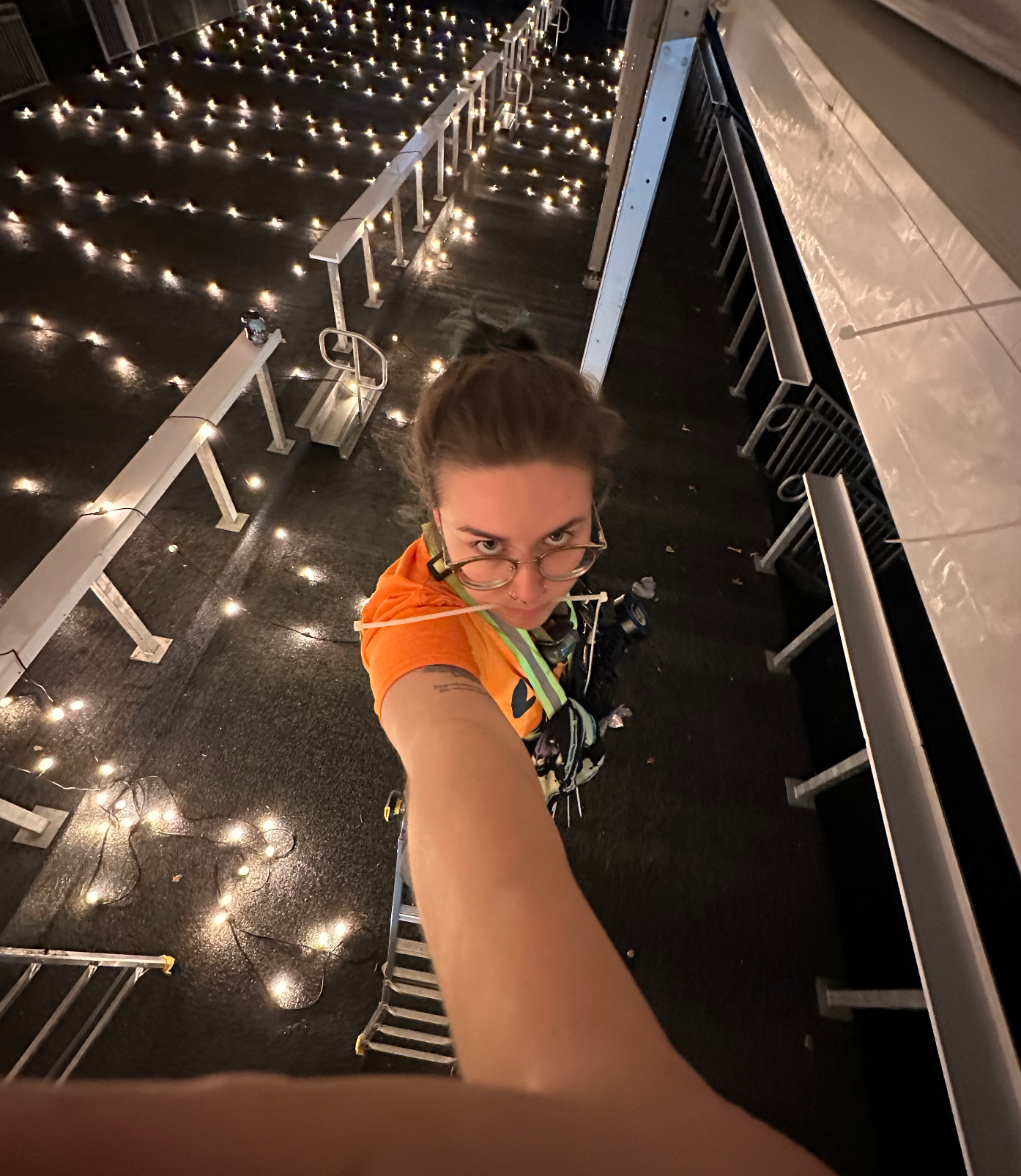 Hanging lights in the VIP tent.