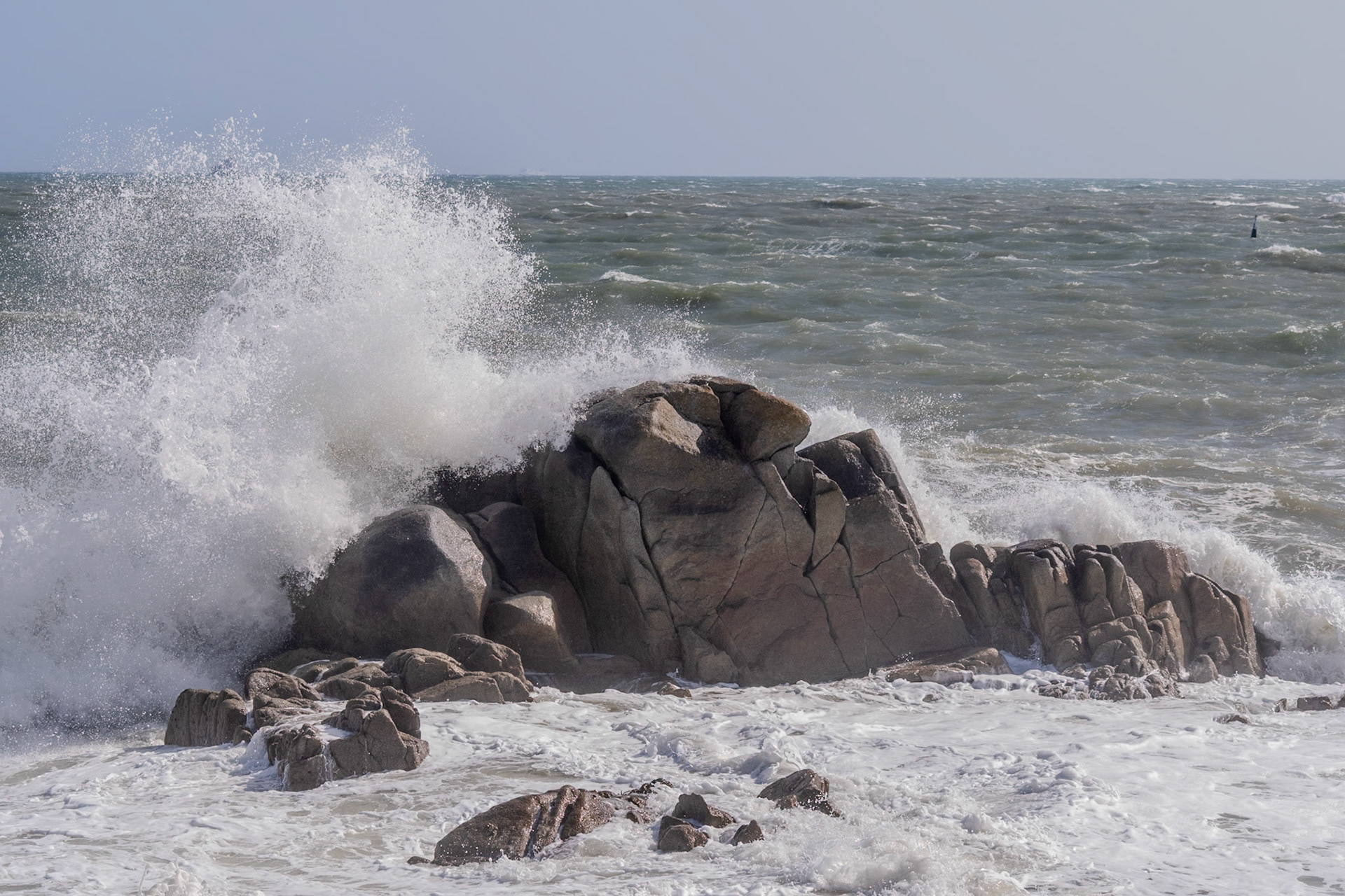 A study in contrast and chaos—where the relentless rhythm of the tide meets the immovable granite of the Dublin coast.