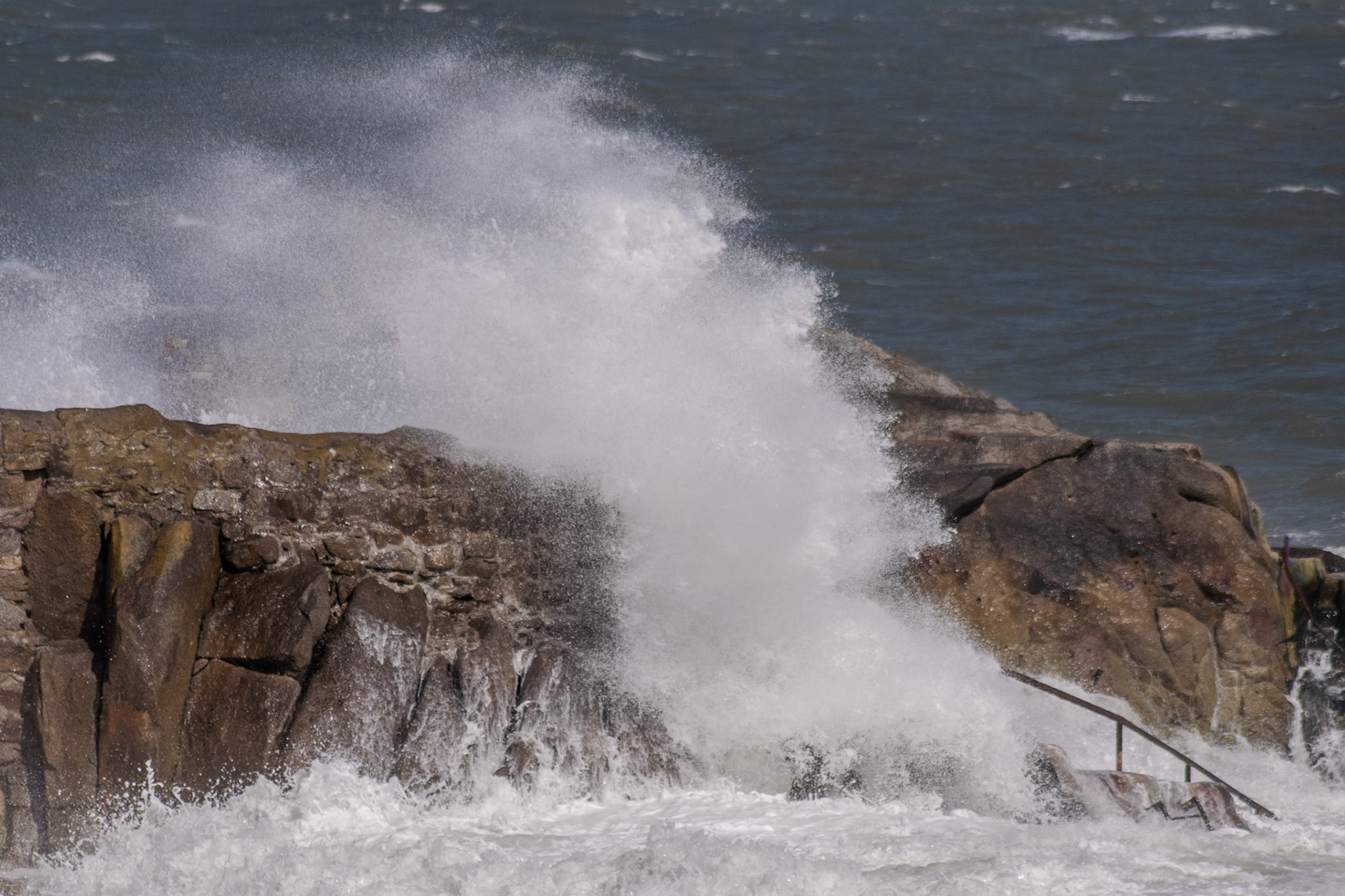 A study in contrast and chaos—where the relentless rhythm of the tide meets the immovable granite of the Dublin coast.