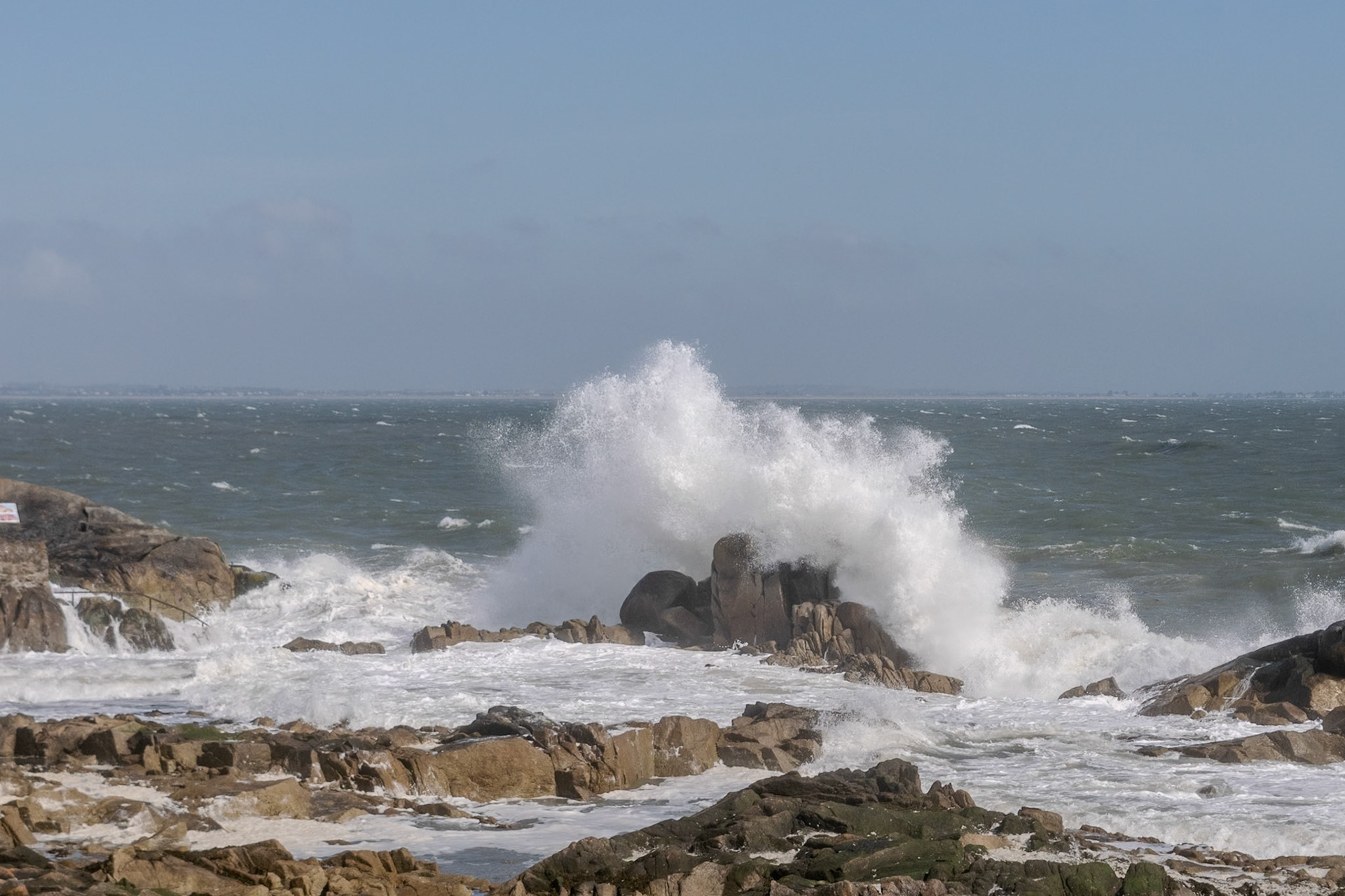 A study in contrast and chaos—where the relentless rhythm of the tide meets the immovable granite of the Dublin coast.