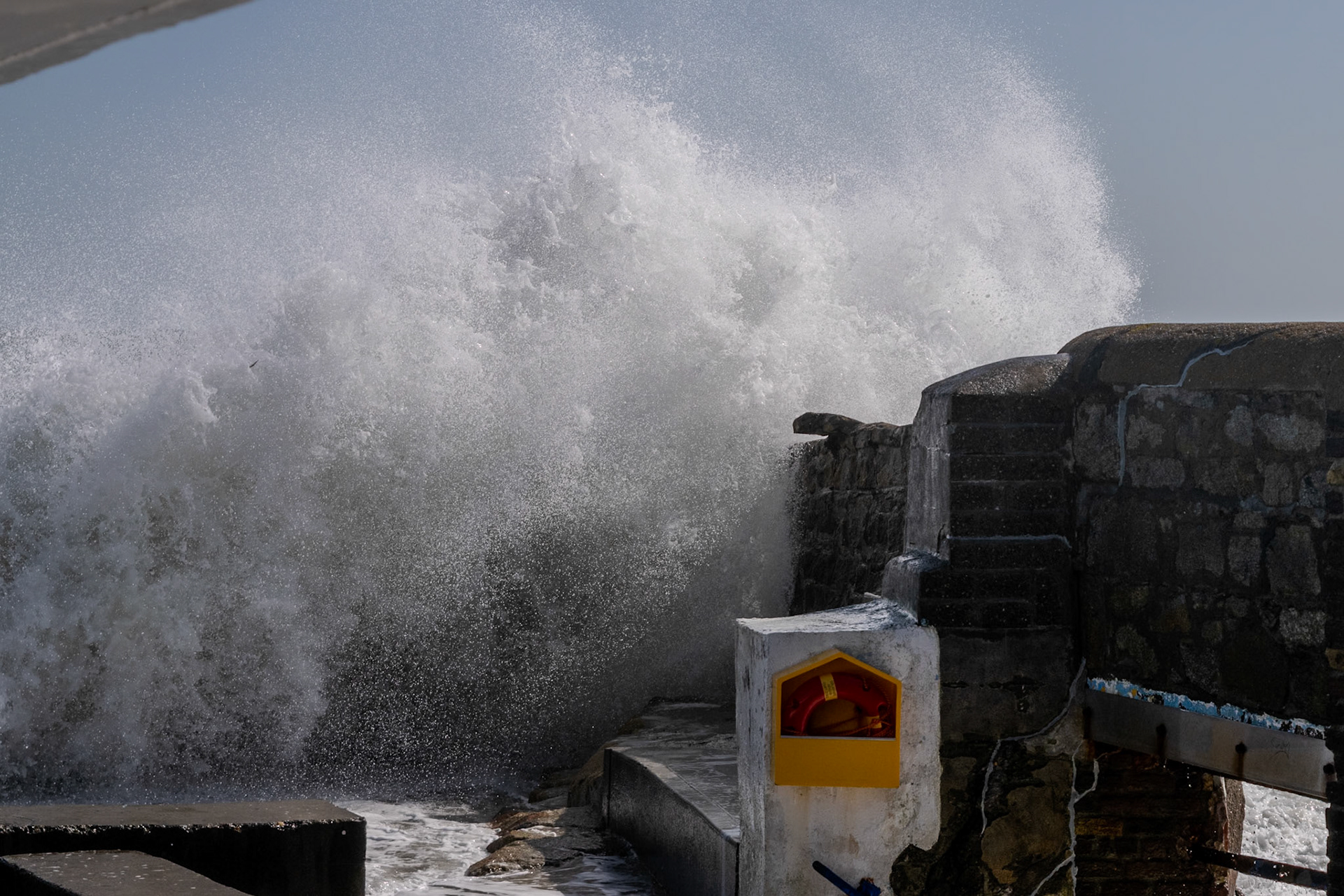A study in contrast and chaos—where the relentless rhythm of the tide meets the immovable granite of the Dublin coast.