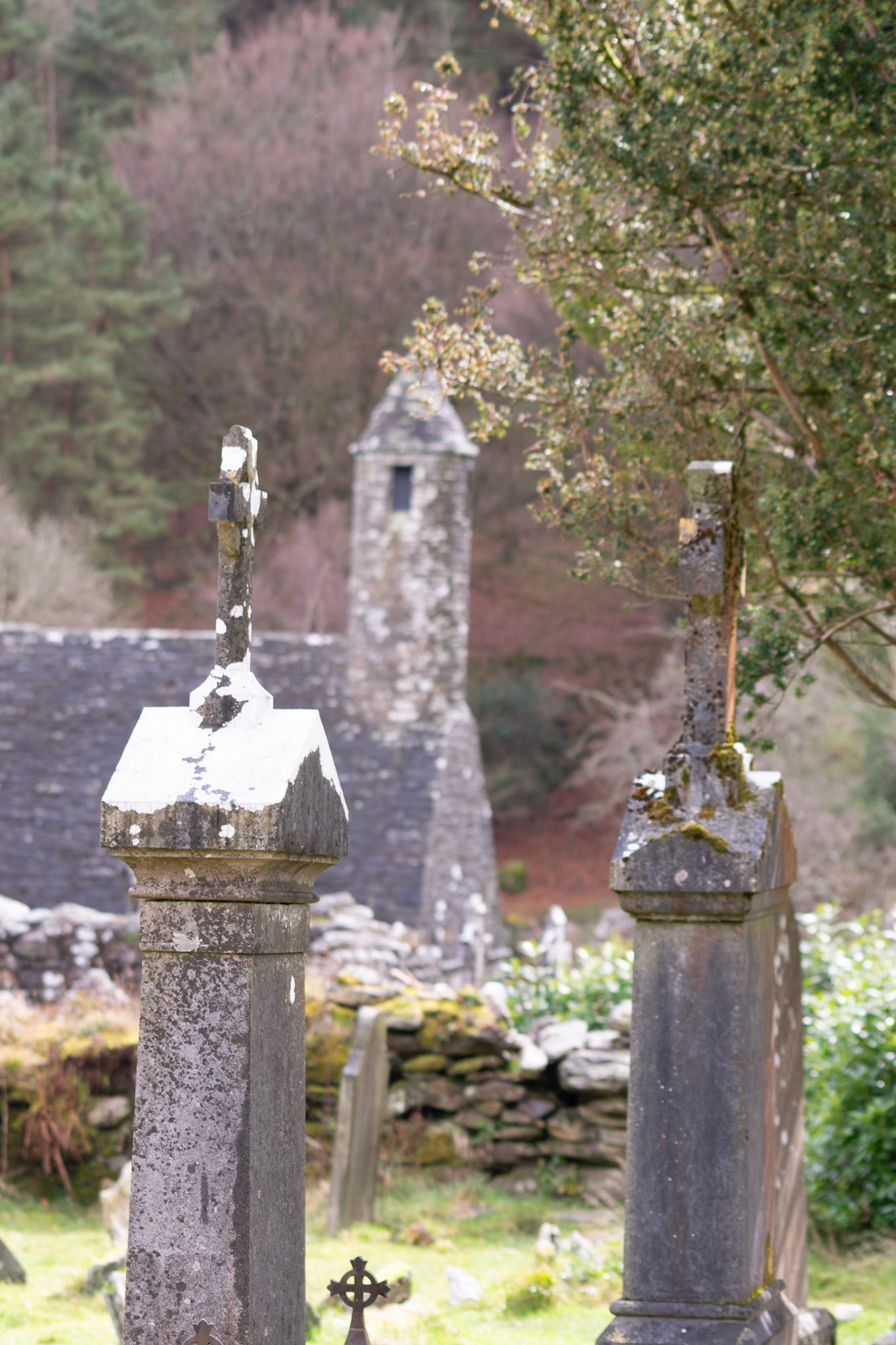 Wandering through the ancient, moss-covered ruins and weathered high crosses of Glendalough's 6th-century monastic city.