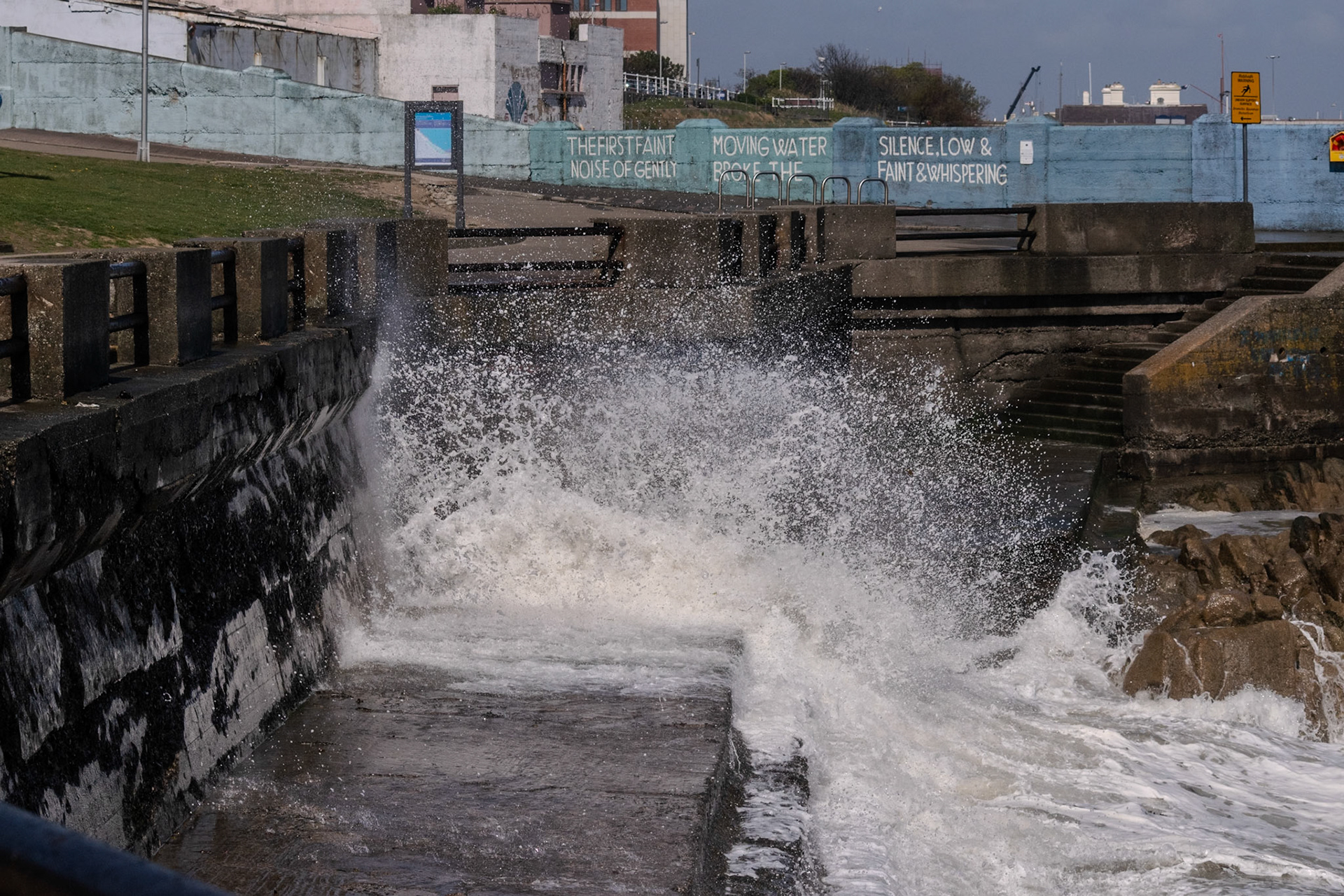 A study in contrast and chaos—where the relentless rhythm of the tide meets the immovable granite of the Dublin coast.