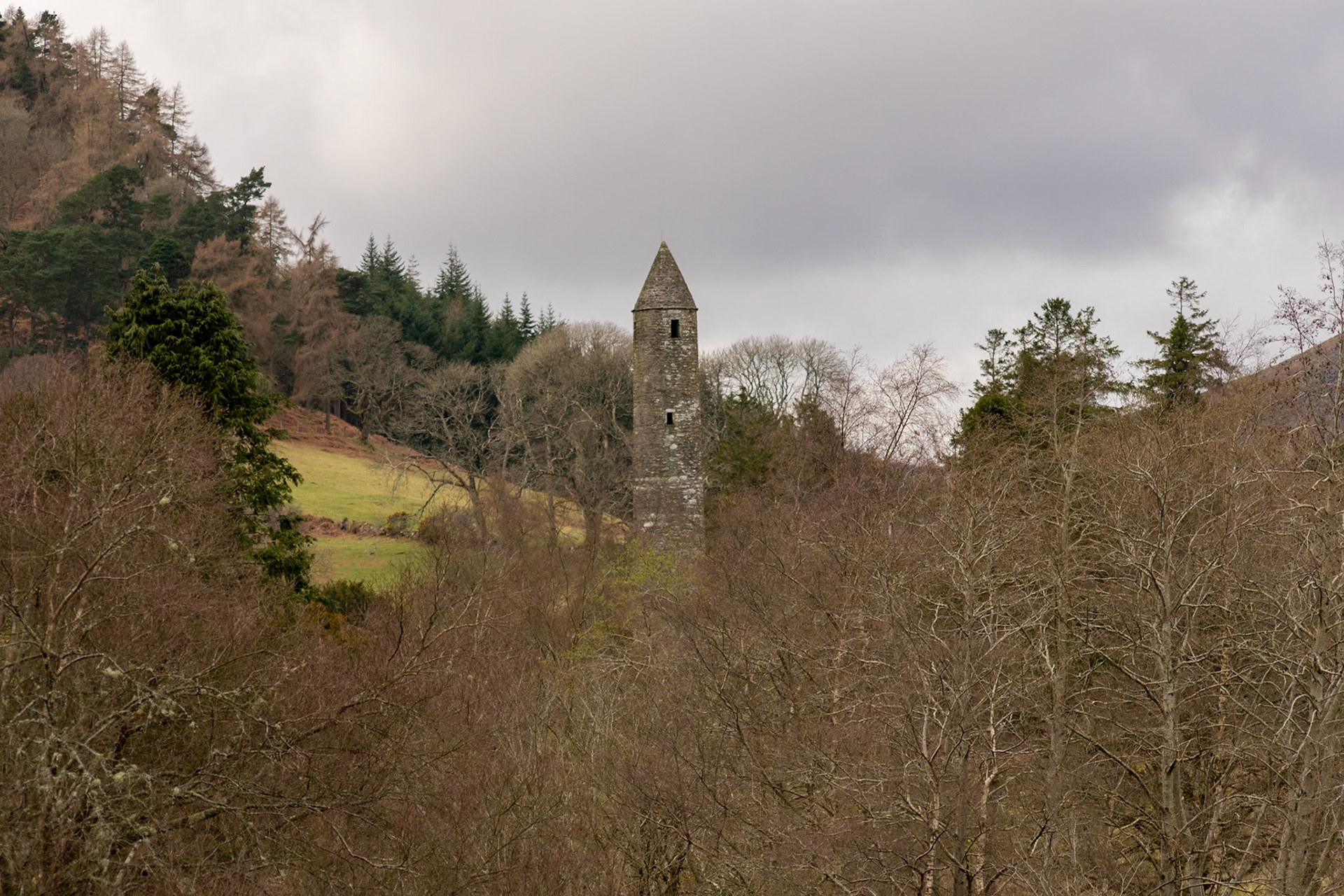 Wandering through the ancient, moss-covered ruins and weathered high crosses of Glendalough's 6th-century monastic city.