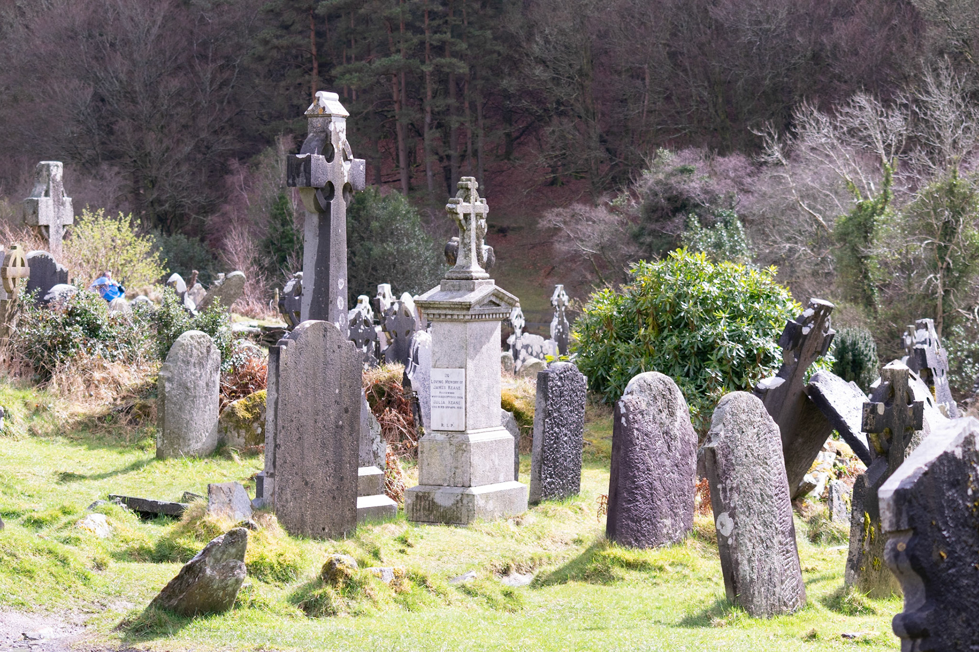 Wandering through the ancient, moss-covered ruins and weathered high crosses of Glendalough's 6th-century monastic city.