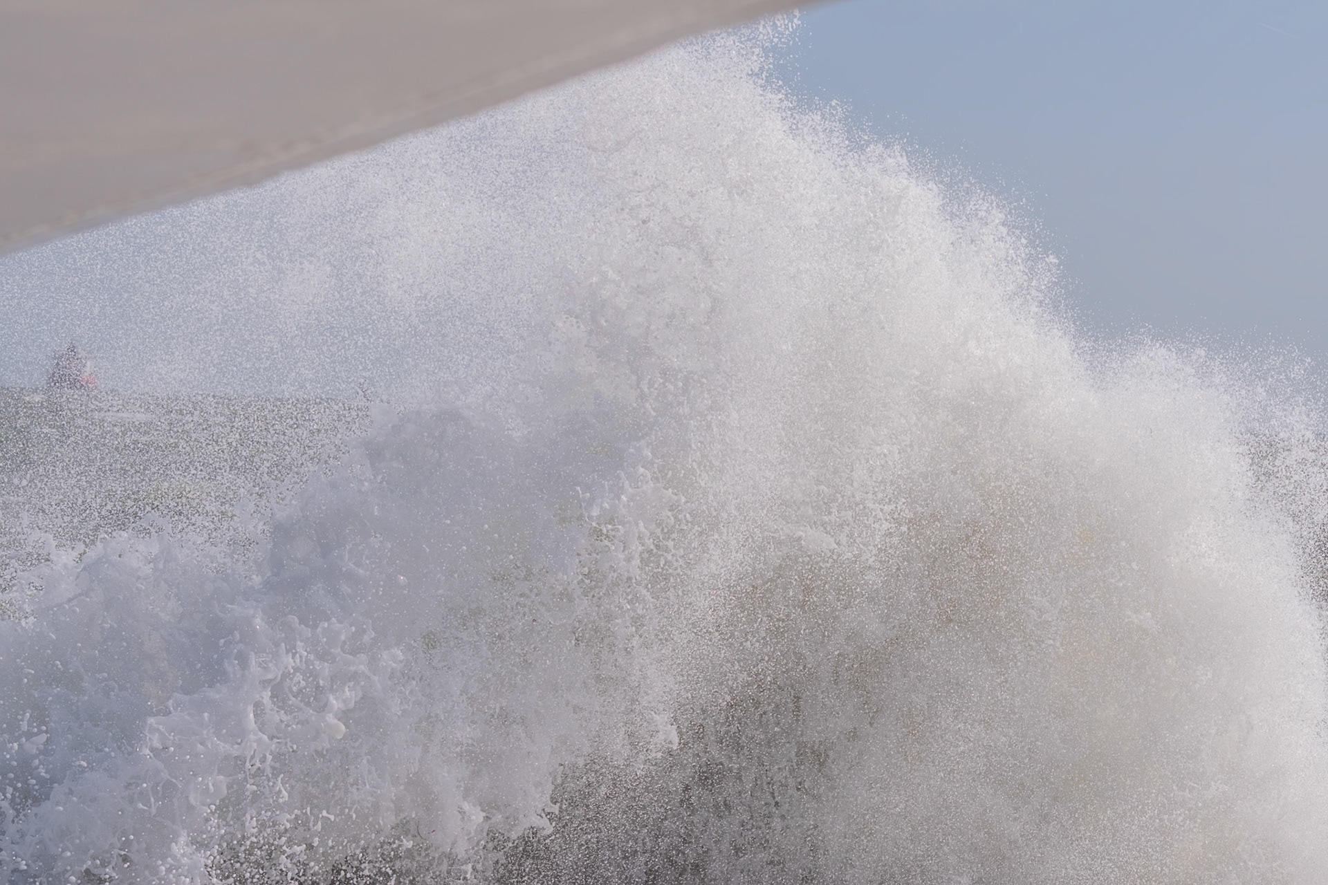 A study in contrast and chaos—where the relentless rhythm of the tide meets the immovable granite of the Dublin coast.