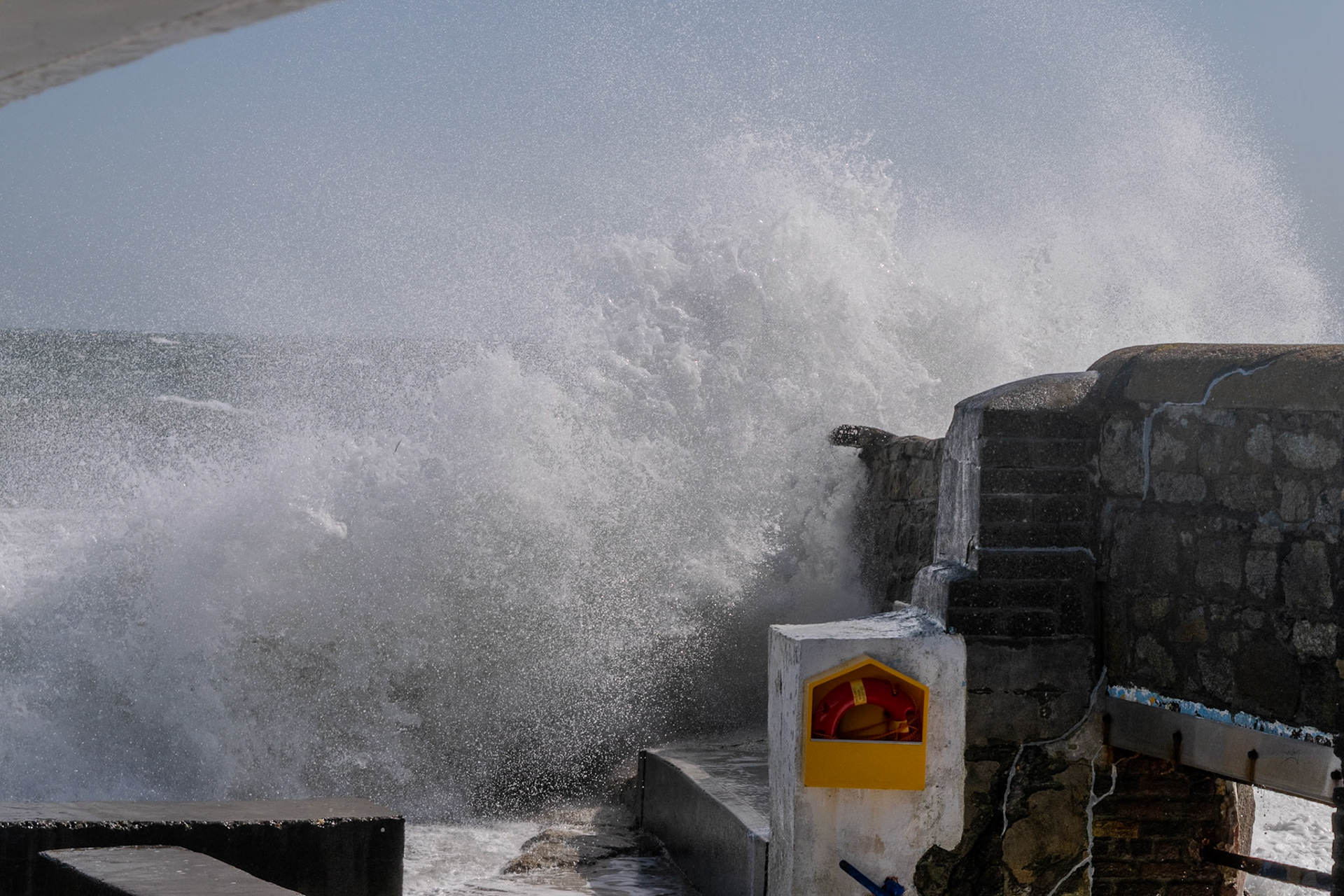 A study in contrast and chaos—where the relentless rhythm of the tide meets the immovable granite of the Dublin coast.