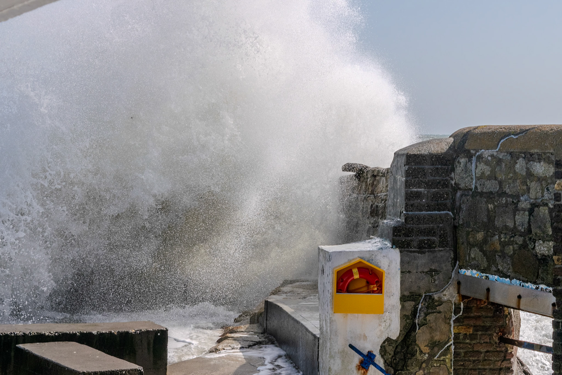 A study in contrast and chaos—where the relentless rhythm of the tide meets the immovable granite of the Dublin coast.